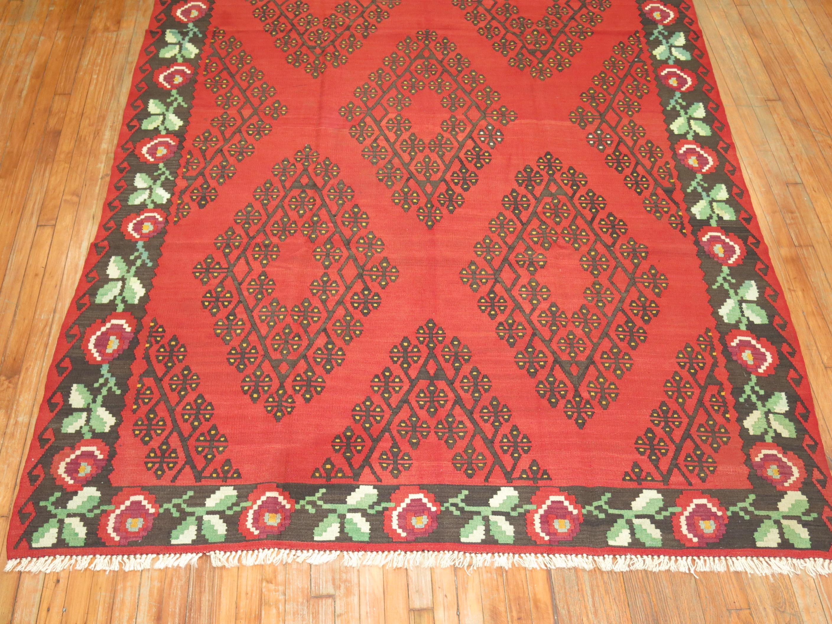 Affordably priced hand-made r intermediate size Besserabian Kilim with floral elements throughout.

6'10'' x 10'7''