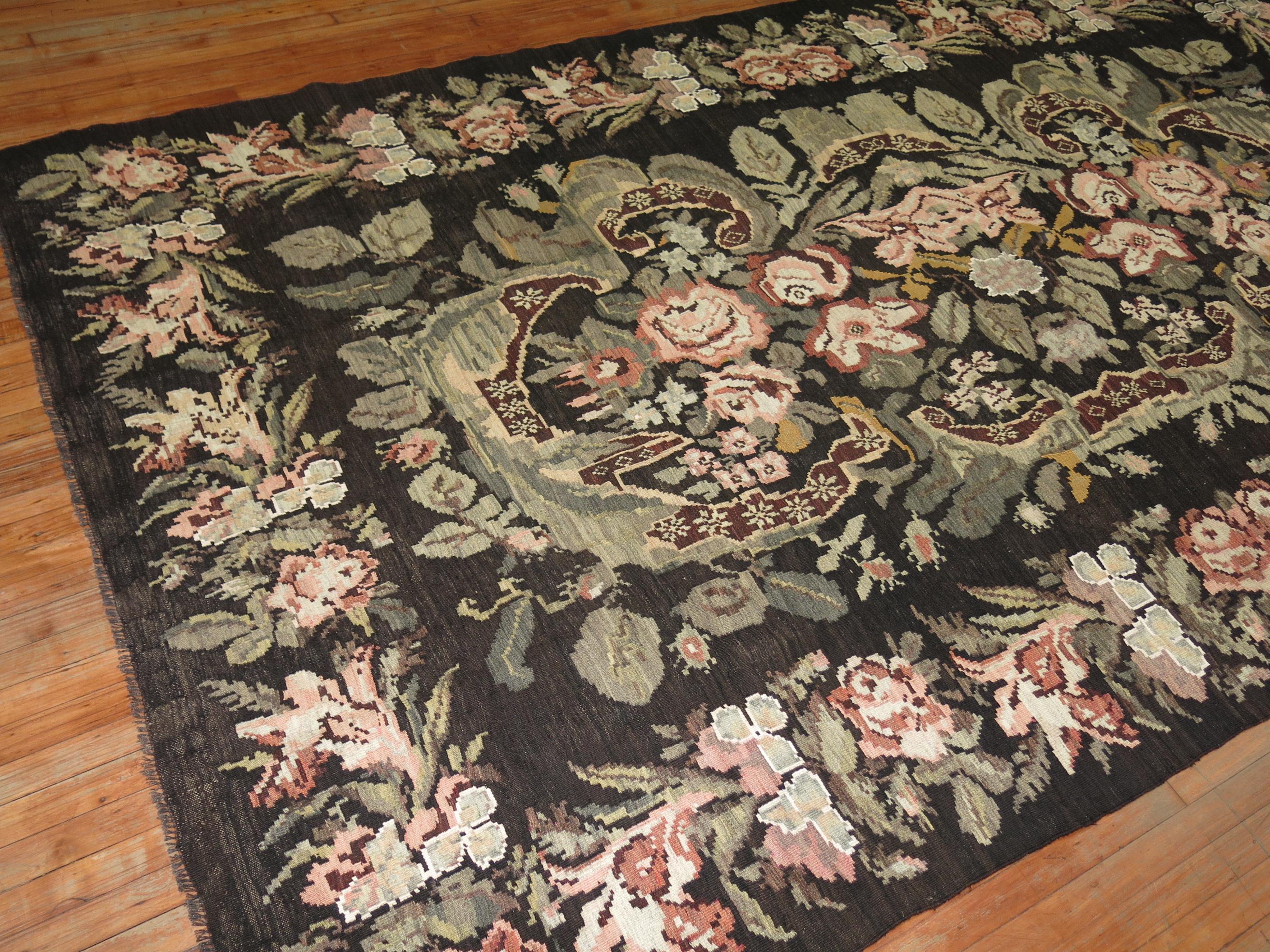 A Midcentury gallery size Besserabian Kilim with floral elements throughout.

7'2'' x 12'