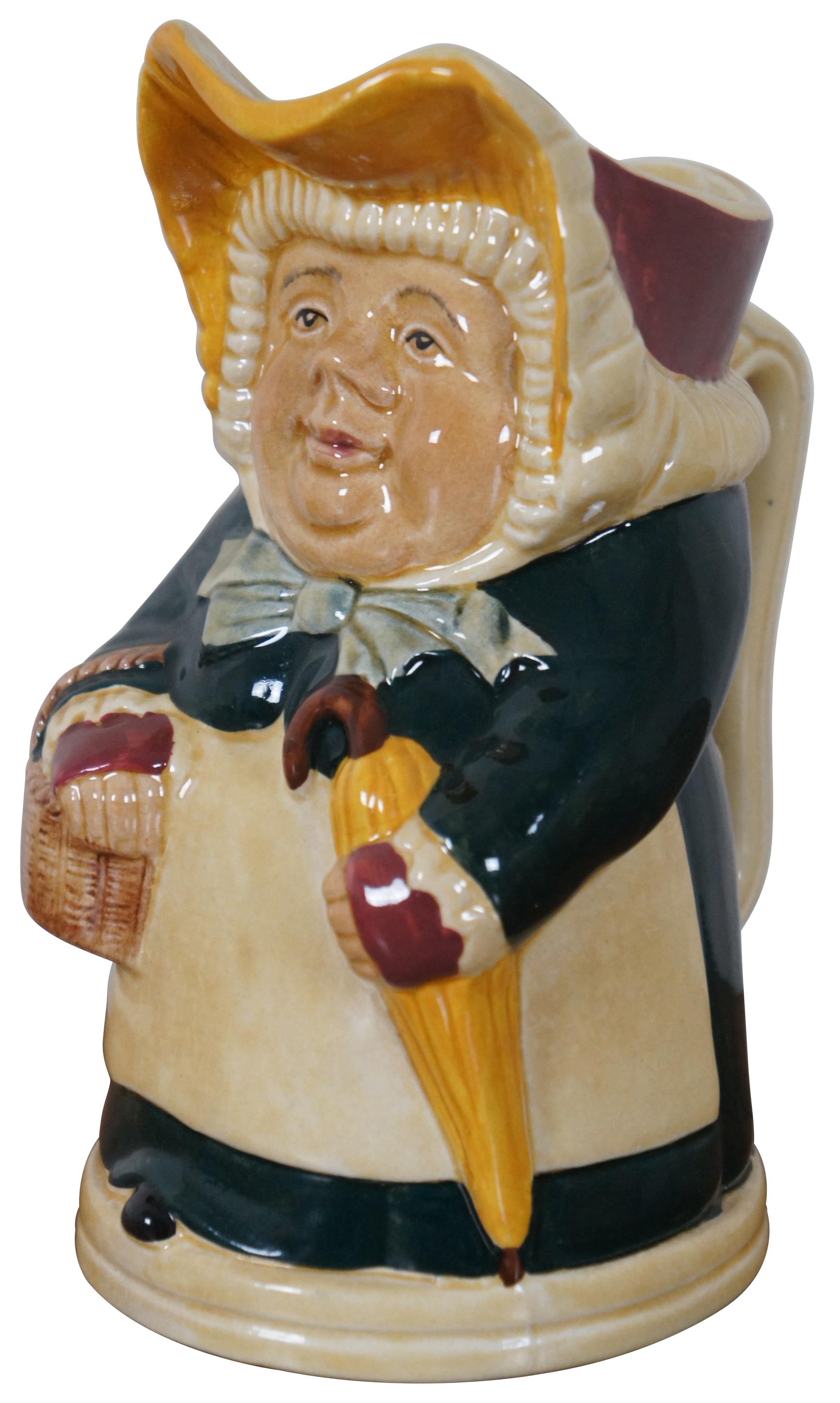 Vintage figural character mug / toby jug by Wood and sons, titled Betsy, portraying a woman in a green dress with bonnet, basket and umbrella.

