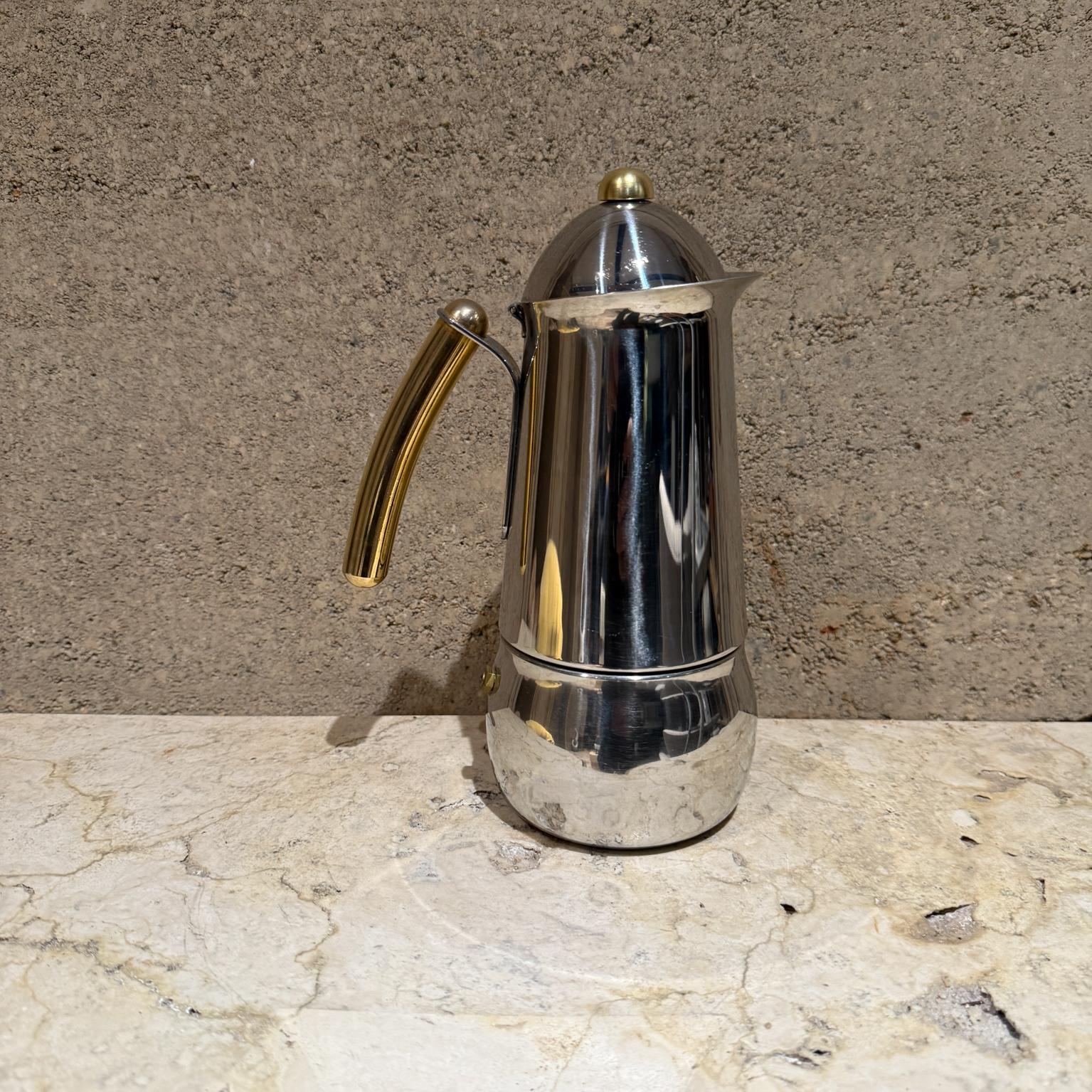 For your consideration, a vintage Bialetti moka expresso machine. Made in Italy. Stainless steel with brass accents.

Dimensions: 9.5 H x 4 diameter x 6 D

Please visit take a look at our listings, we have an amazing curated collection of hard to