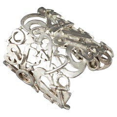 Vintage BICHE de BERE Overlapping Numbers Figural Wide Silver Cuff Bracelet