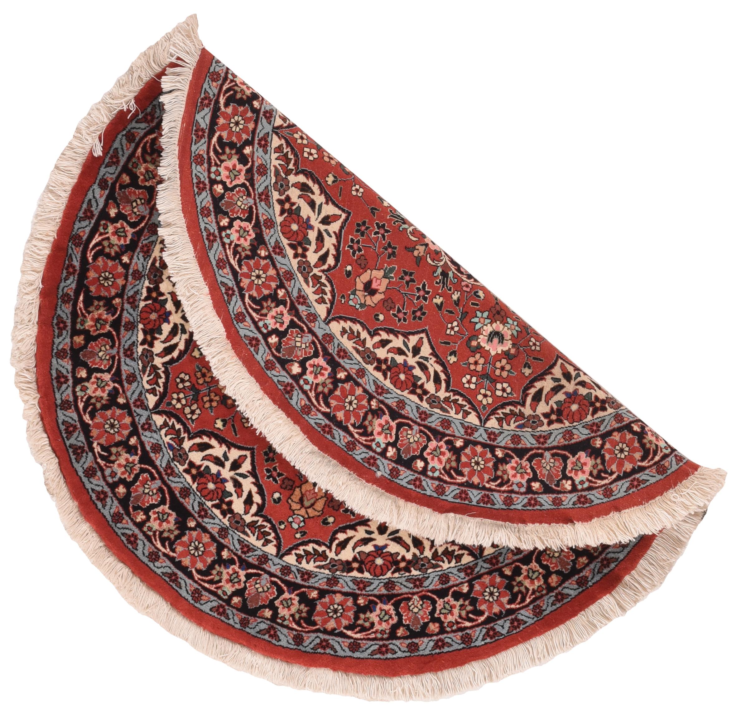 Vintage Bidjar rug 3'3'' x 3'3''. Round or oval rugs are woven on regular square or rectangular looms.. This well-woven example shows an eight-pointed red star-like field centred by a navy acanthus volute octofoil medallion with a red and cream