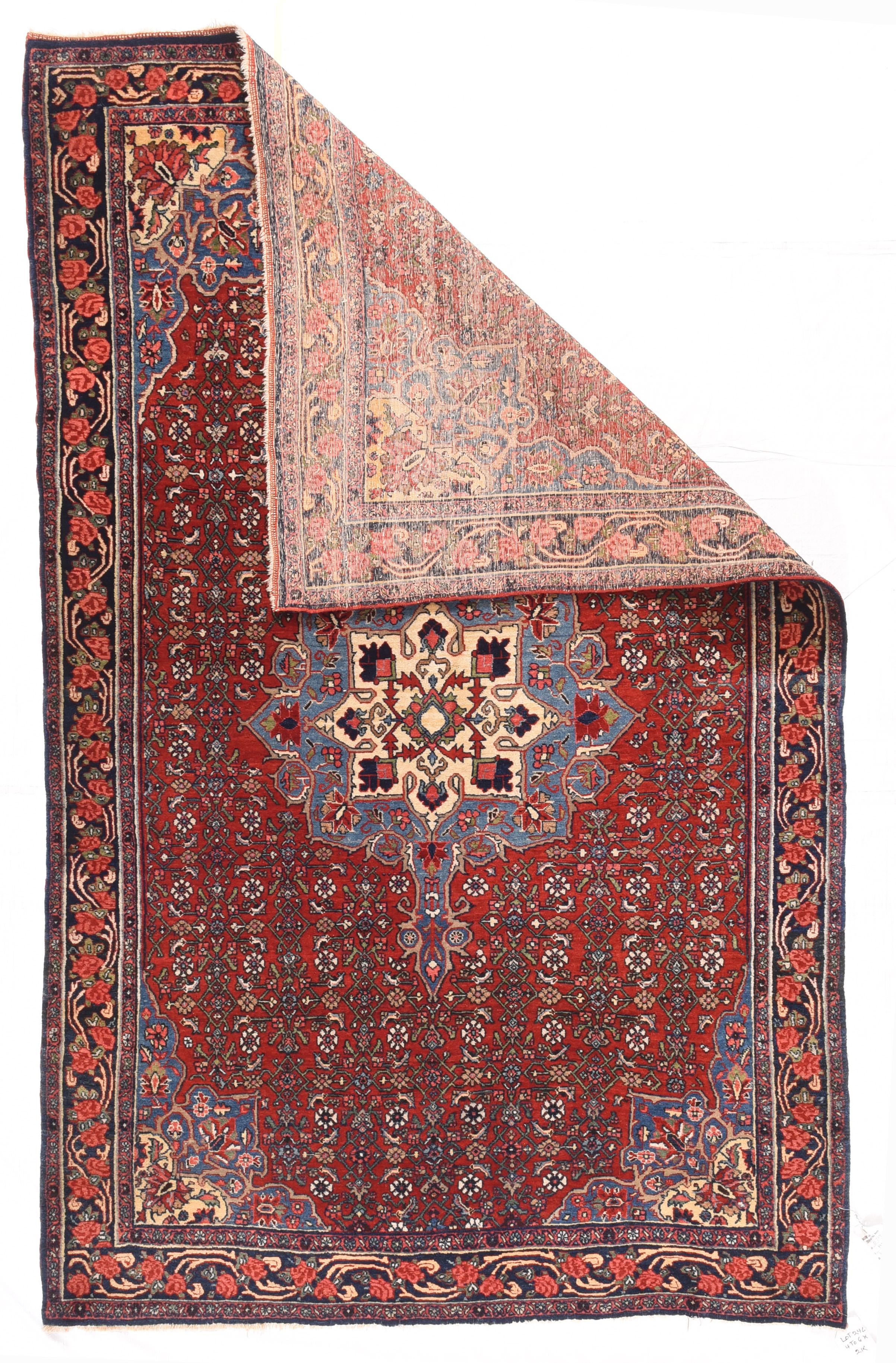 Vintage Bidjar Rug 4'3'' x 6'10''. A teal blue spearhead finialed octogramme medallion enclosing a conforming cream Sub medallion with radiating palmettes, floats on the close red Herati field. The teal corners carry on the chromatic theme. Red and