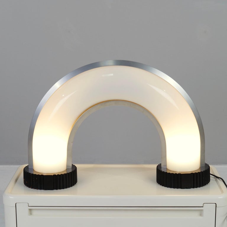 rare space age bow table lamp. 

Italy 1976 - Bieffeplast Design by Adalberto dal Lago & Stefania Giannotti

dimensions:
43 cm height
63 cm width
15 cm depth
material:
metal, opaline acrylic, wood