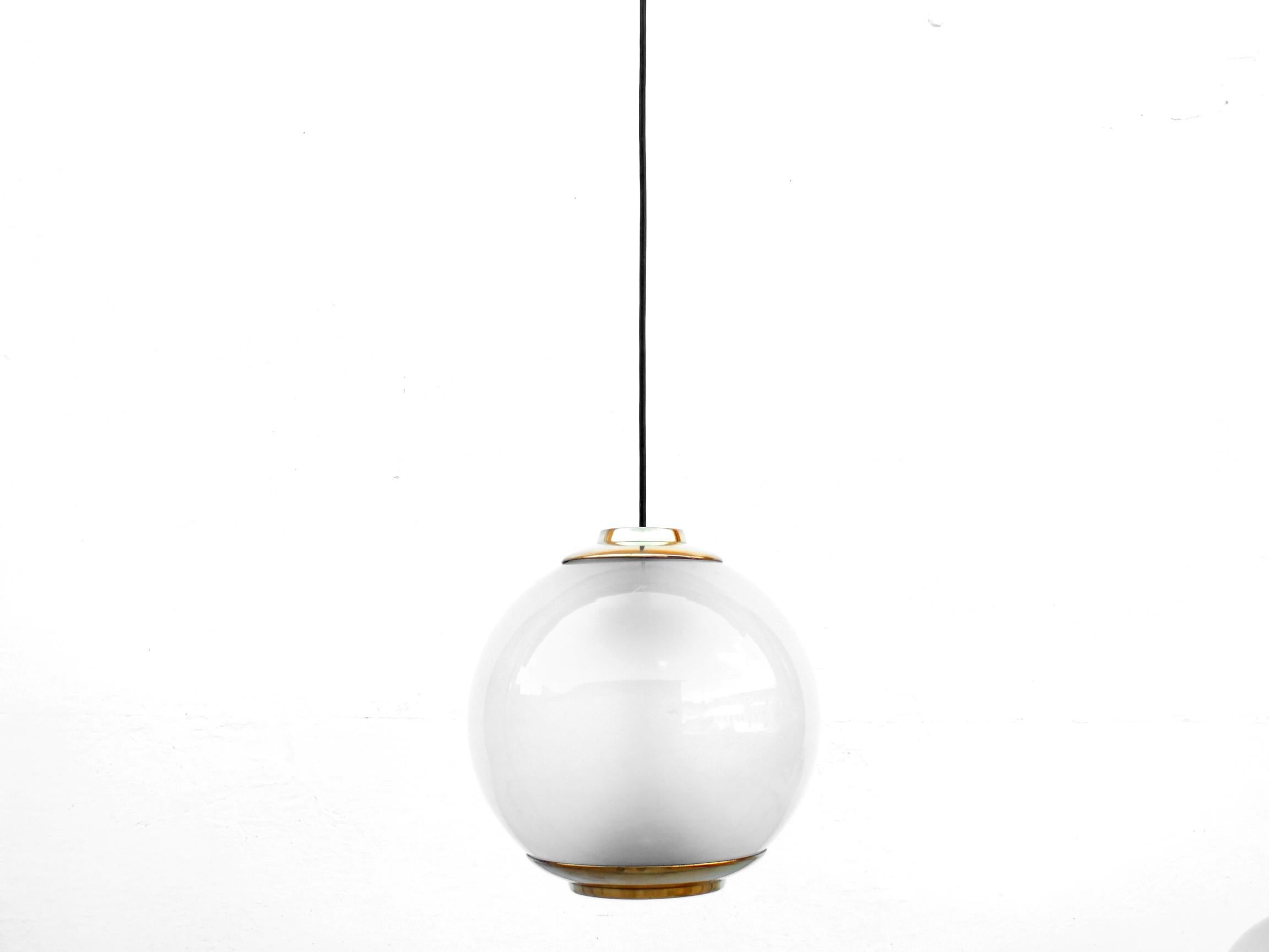 Luigi Caccia Dominioni design one rare big ball ceiling lamps Ls2 by Azucena Italy production in years ’52 The piece features a spherical milk glass shade as well as a mounting in polished brass and ceiling black cable. The sell is for one ceiling