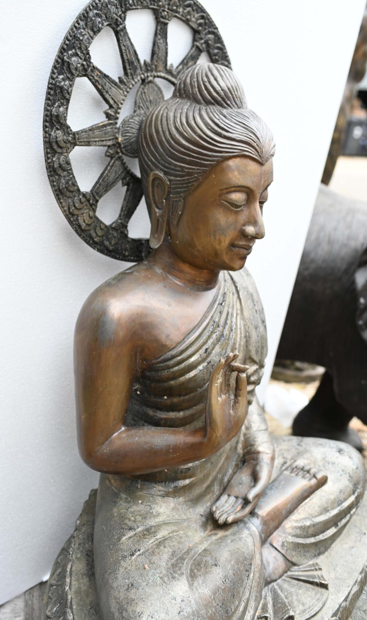 You are viewing a vintage Nepalese buddha statue in bronze
The statue is almost four feet tall - 115 CM - so great for outside
Being rust it can sit outside with no fear of rusting
The Buddha’s right hand is raised in the abhaya mudra, a gesture
