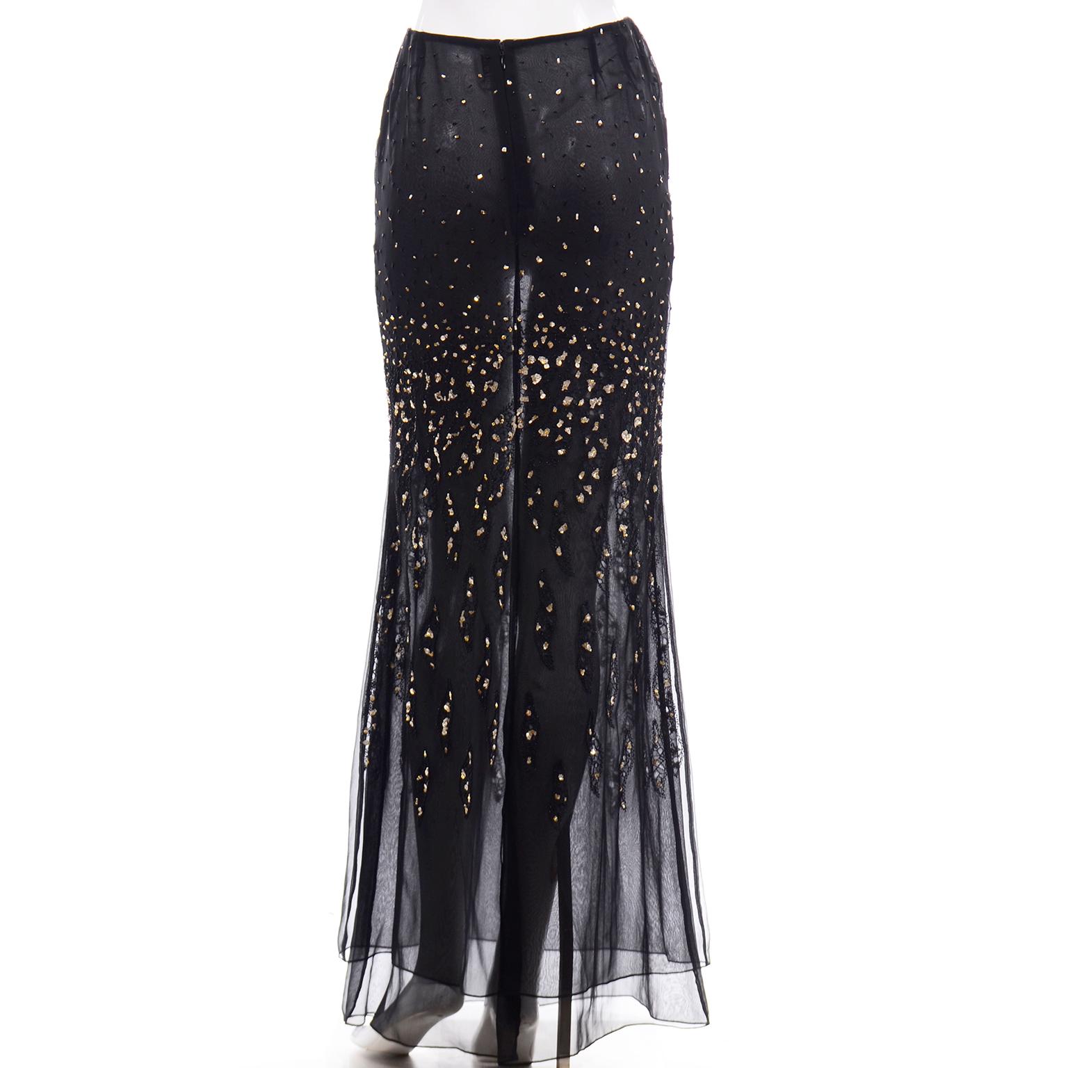 This stunning vintage Bill Blass sheer black silk skirt is beautifully beaded and has sequins throughout. The sequins are a silver and gold mix and the beads are black. The skirt has a double layer of black sheer silk and there is a metal zipper