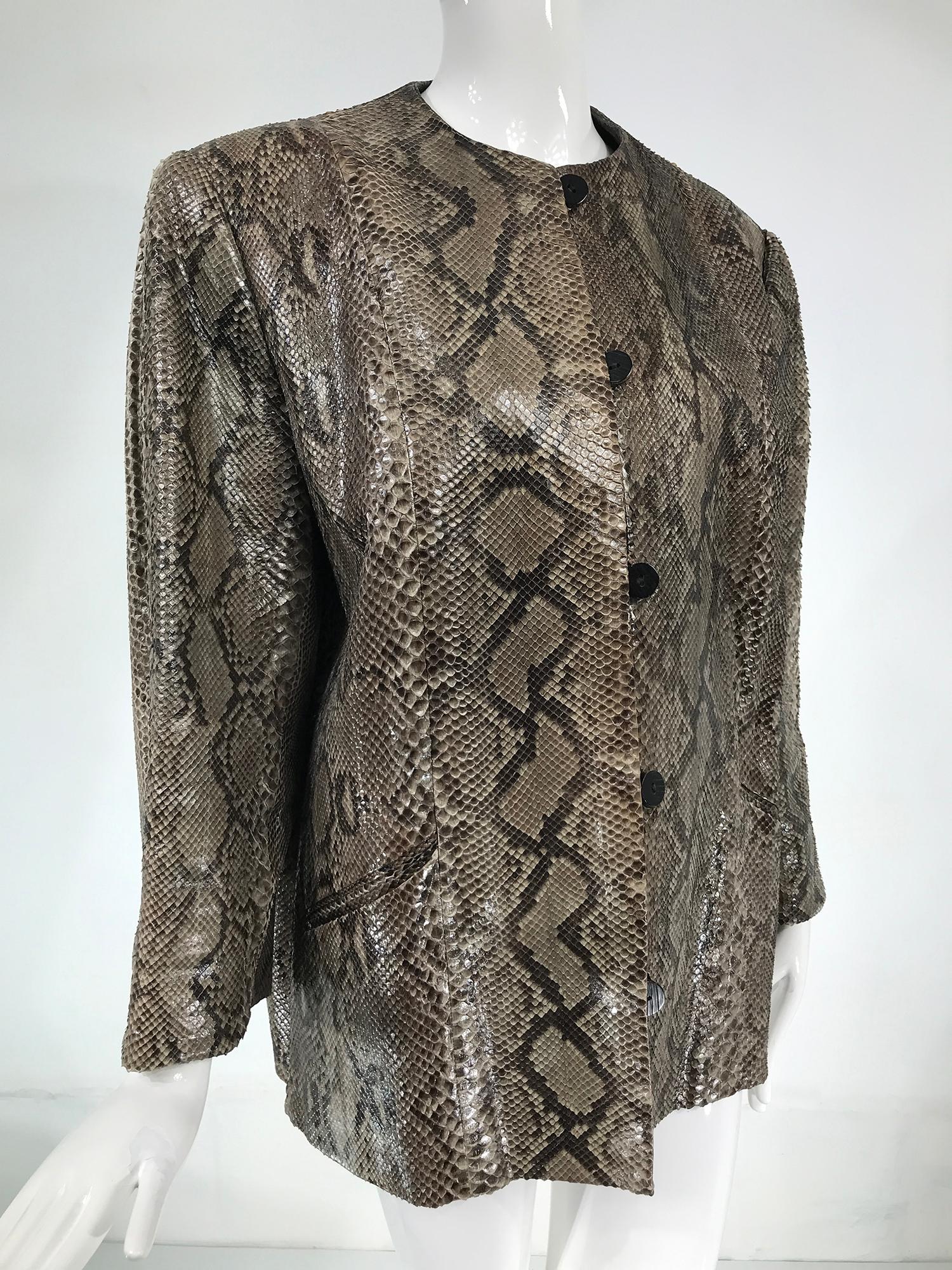 Vintage Bill Blass snakeskin button front jacket from the 1980s. Jewel neck jacket with wrist length sleeves, closes at the front with button & loops. There are angled hip front pockets. This jacket has a boxy shape. It is lined in black rayon. In