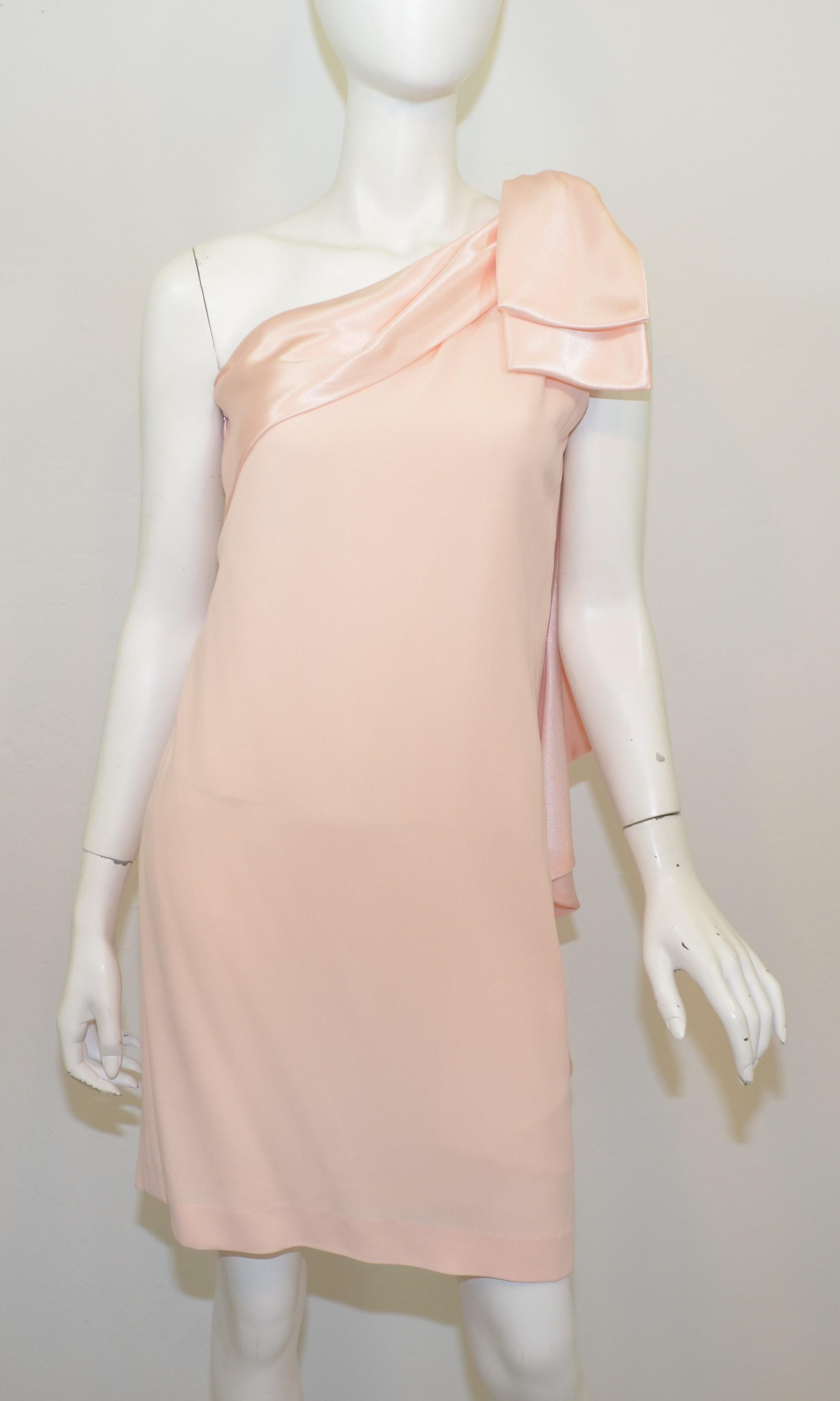 Vintage Bill Blass Pink One-Shoulder Dress -- dress features a large bow that lies on the left shoulder, and a side zipper fastening. Dress is in wonderful vintage condition with no flaws to mention. Labeled size 8.

Measurements:
Bust 36”, waist