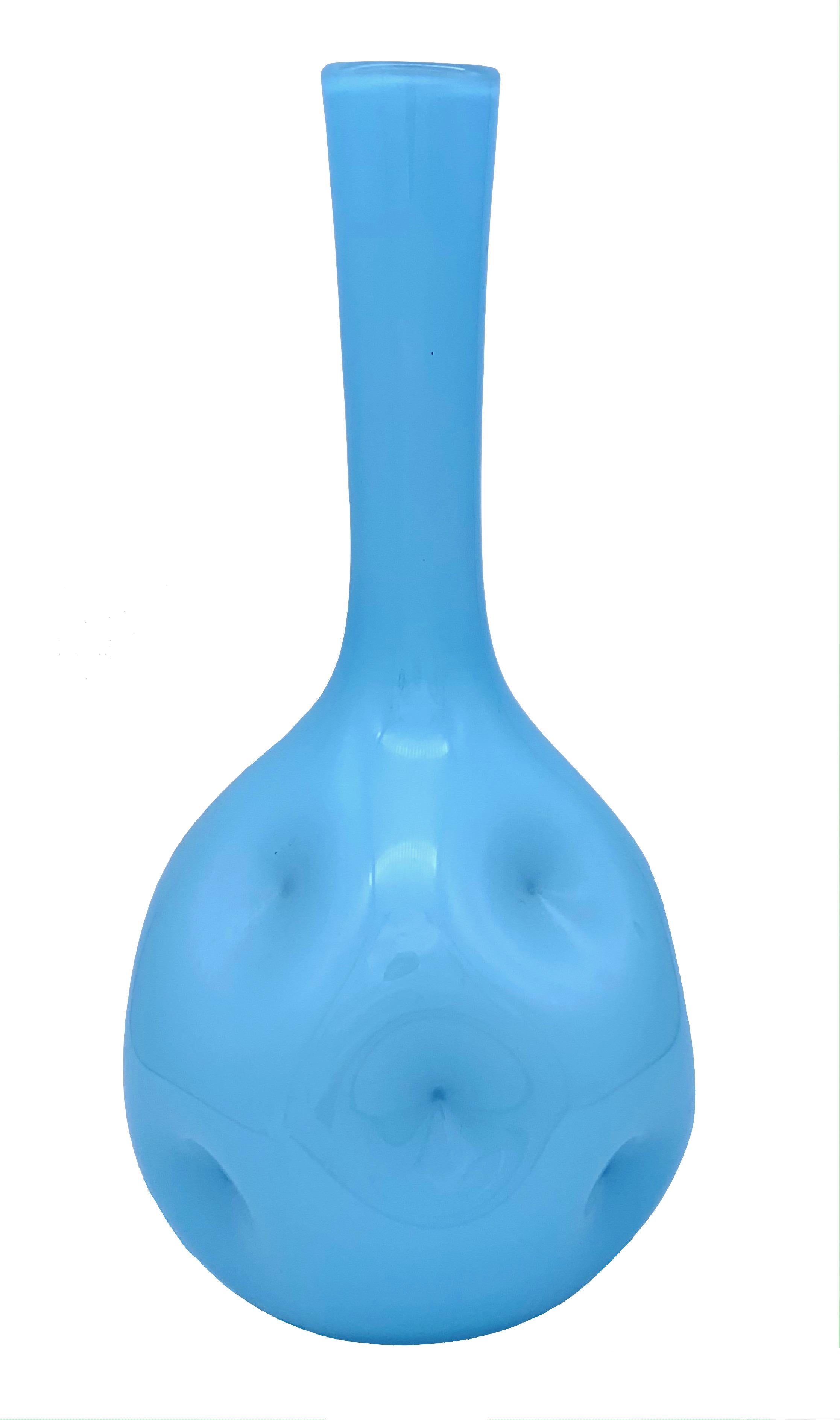 This lovely piece of glas with it's wonderful dimples was hand blown under the blue skies of the Côte d'Azur.
The intensive light blue hue adds joy to any surrounding.