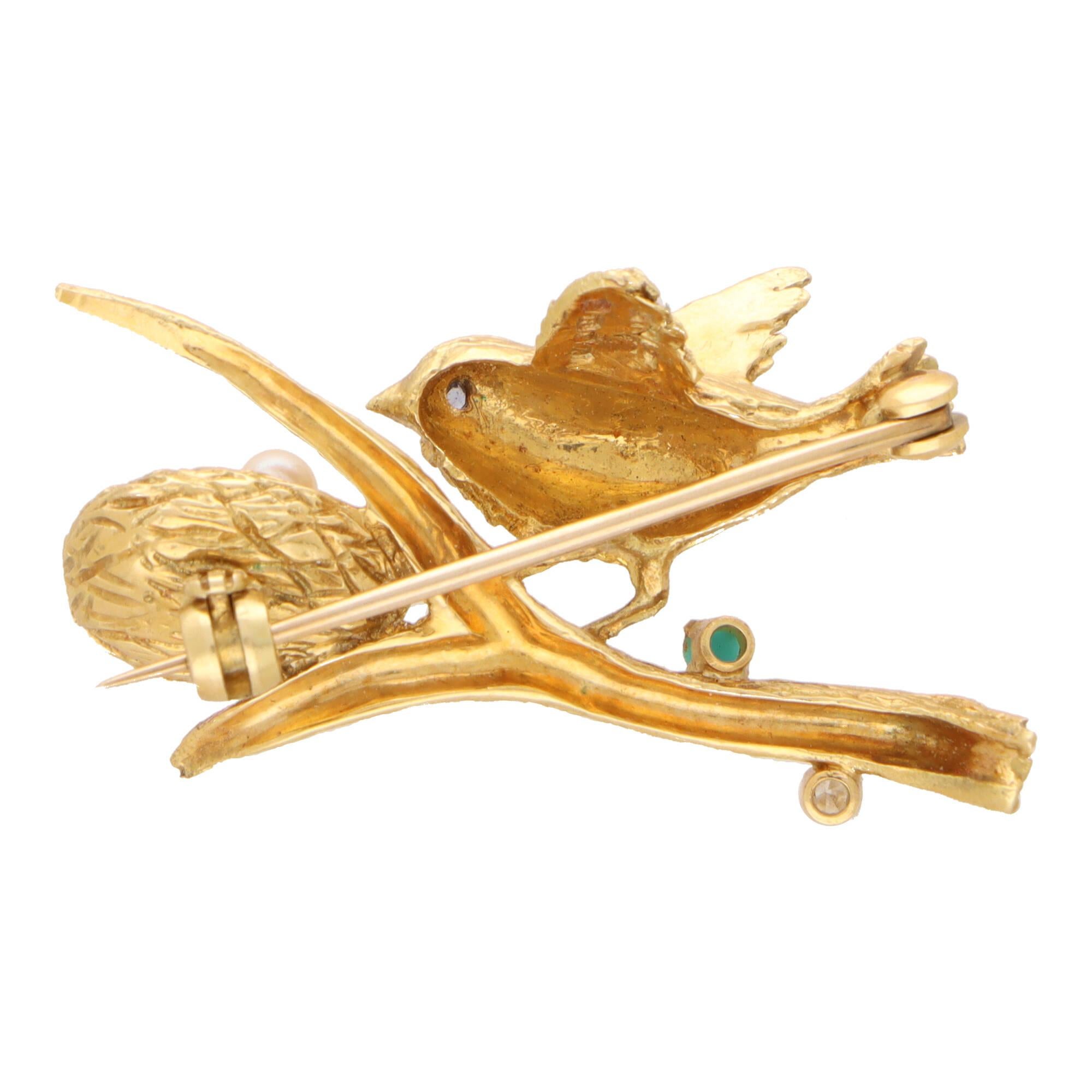 A beautiful vintage bird and nest brooch set in 18k yellow gold.

The brooch depicts a bird perching on a branch beside it’s nest. It has been beautifully hand crafted and the gold has been carved to depict naturalistic features! The nest is set