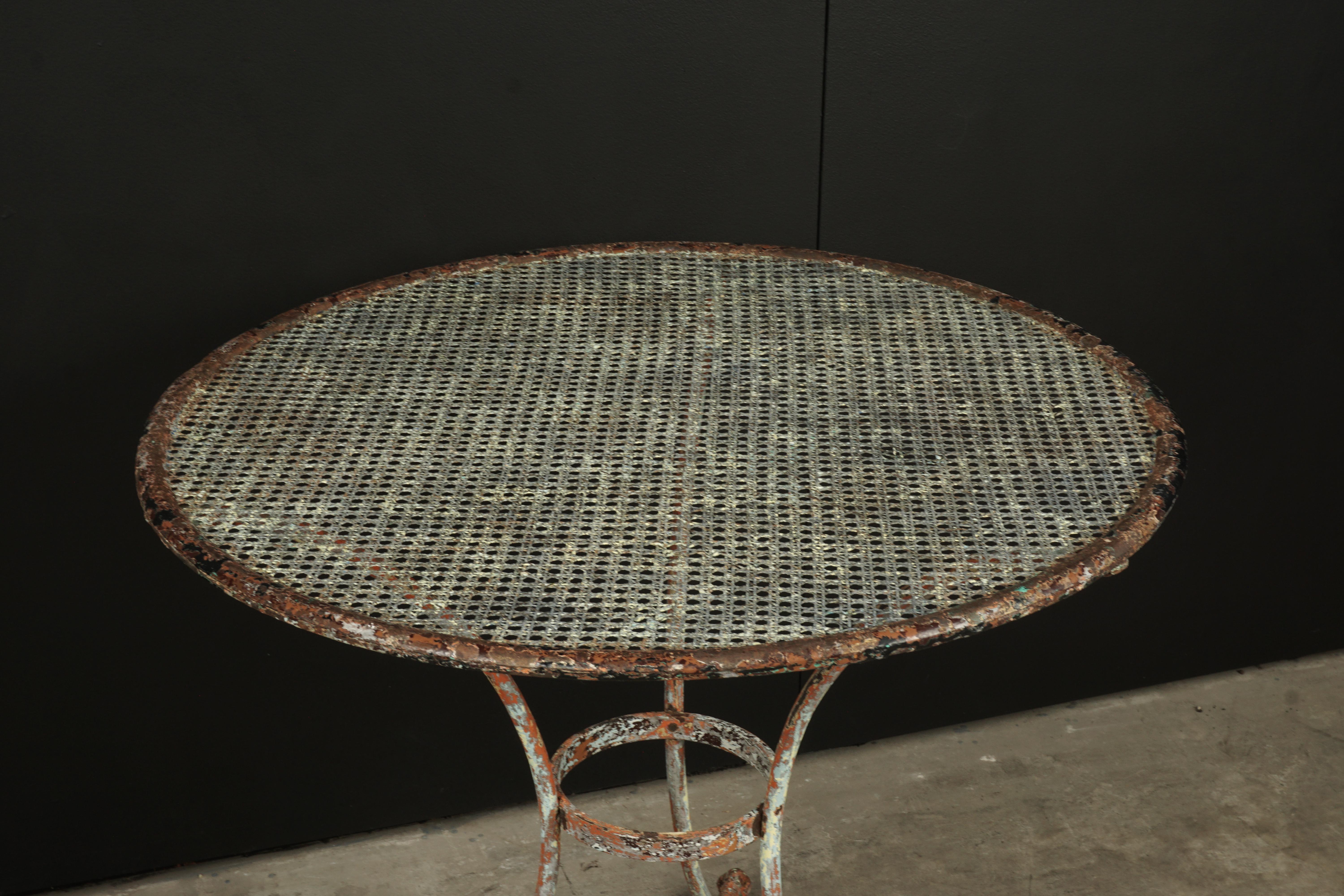 Vintage Bistro table from France, 1950s. Solid steel construction. Fantastic original color and patina.