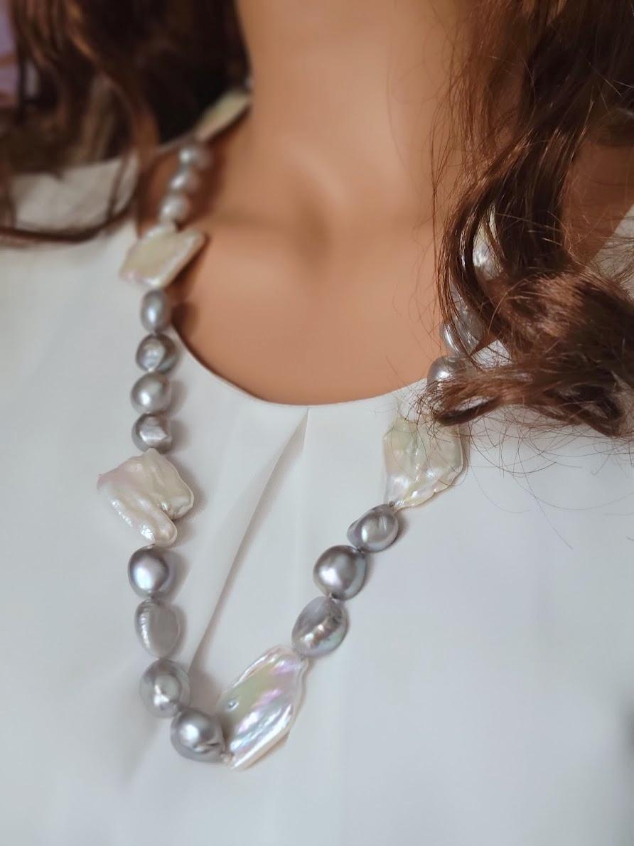 The length of the necklace is 29 inches (74mm).
The irregular shape of baroque pearls varies from 14 to 16mm.
The size of the Biwa pearls varies from 30 to 37mm.

The color of the pearls is silver-grey with strong, bright, and clear luster and
