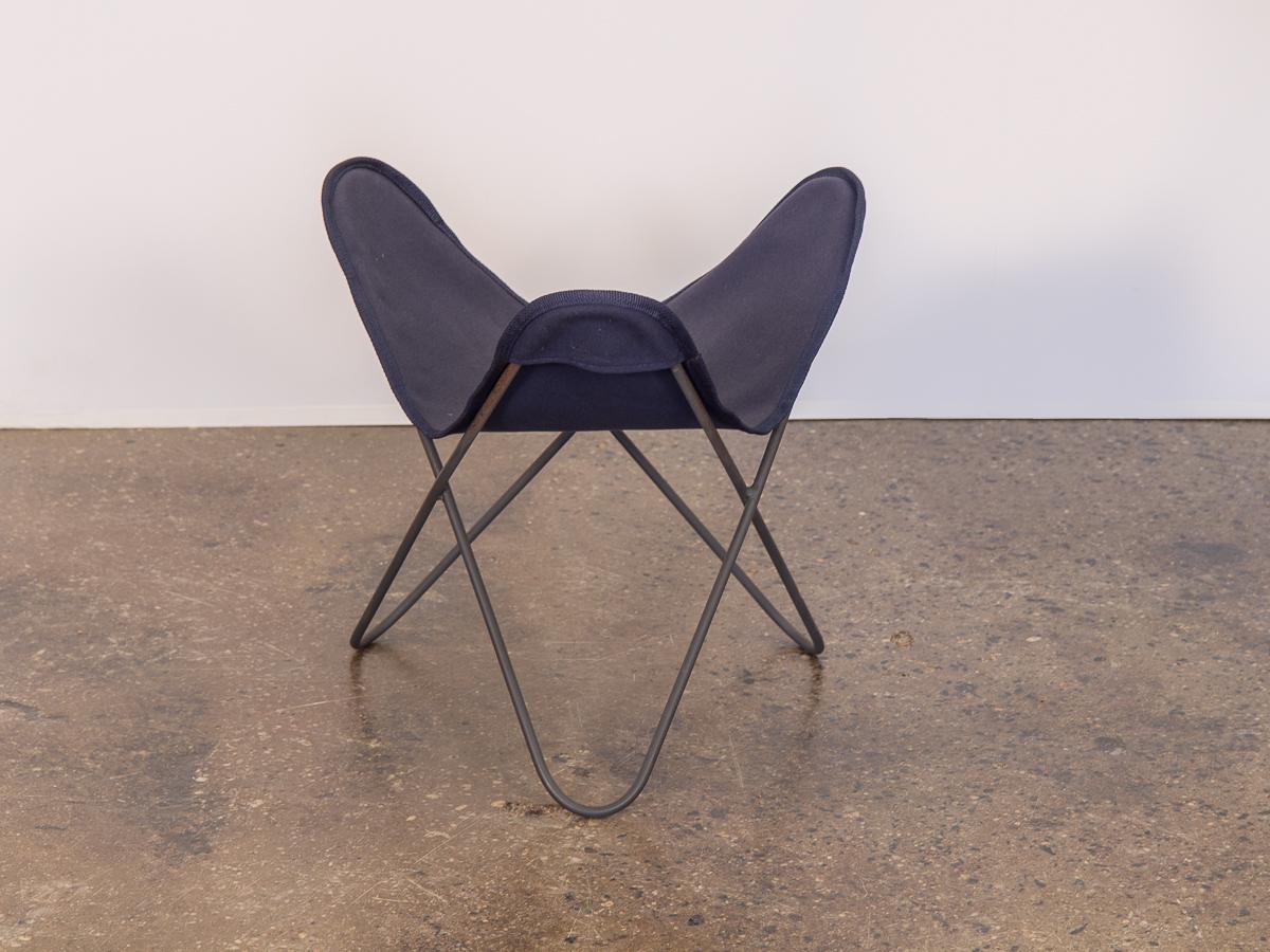 Vintage BKF Hardoy butterfly chair footstool for Knoll. Navy blue sling is in excellent new condition, with no rips, holes, or tears. Black wire frame is strong with all welds intact.