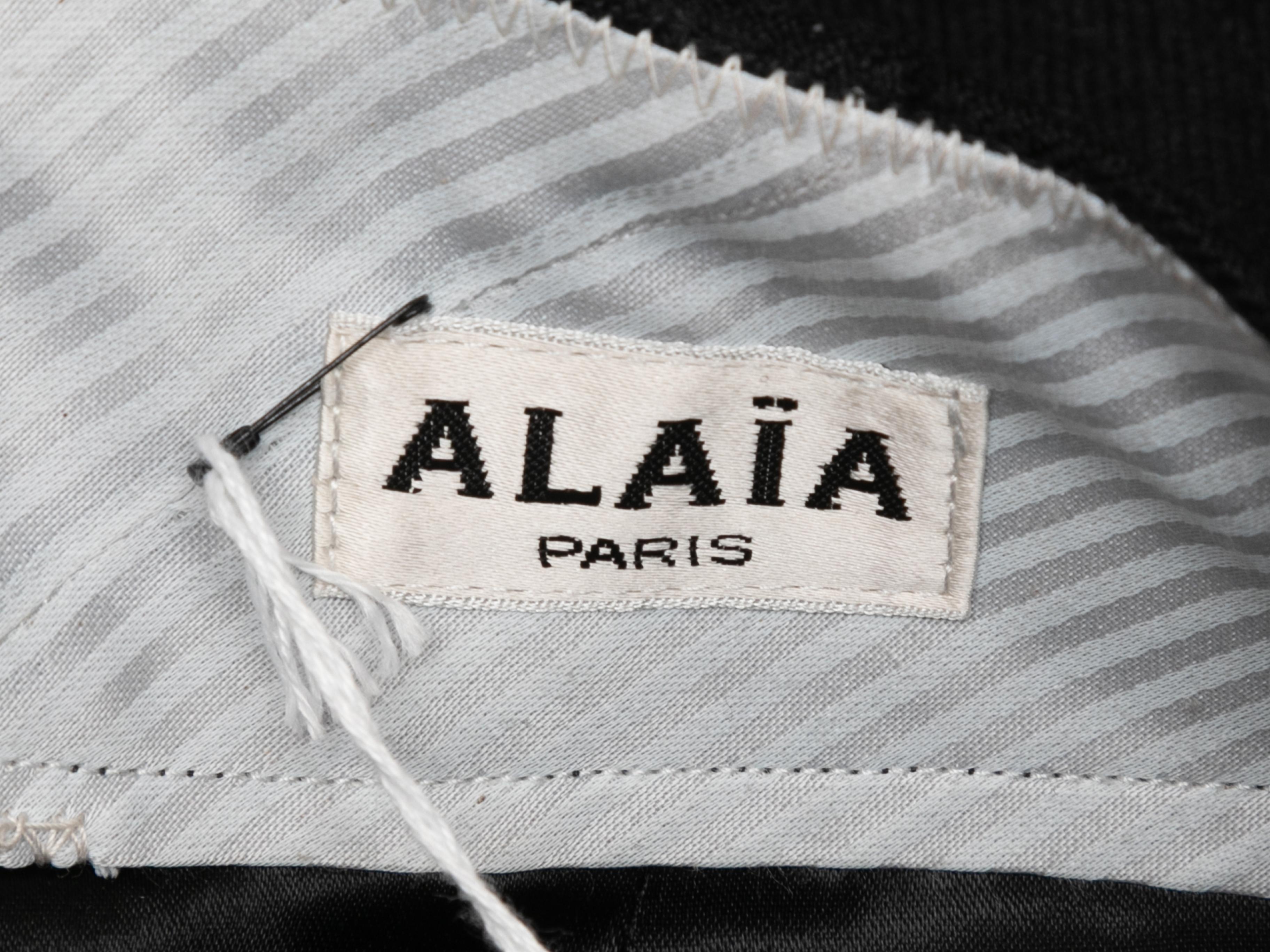Vintage wool pencil skirt by Alaia. Back zip closure. 26