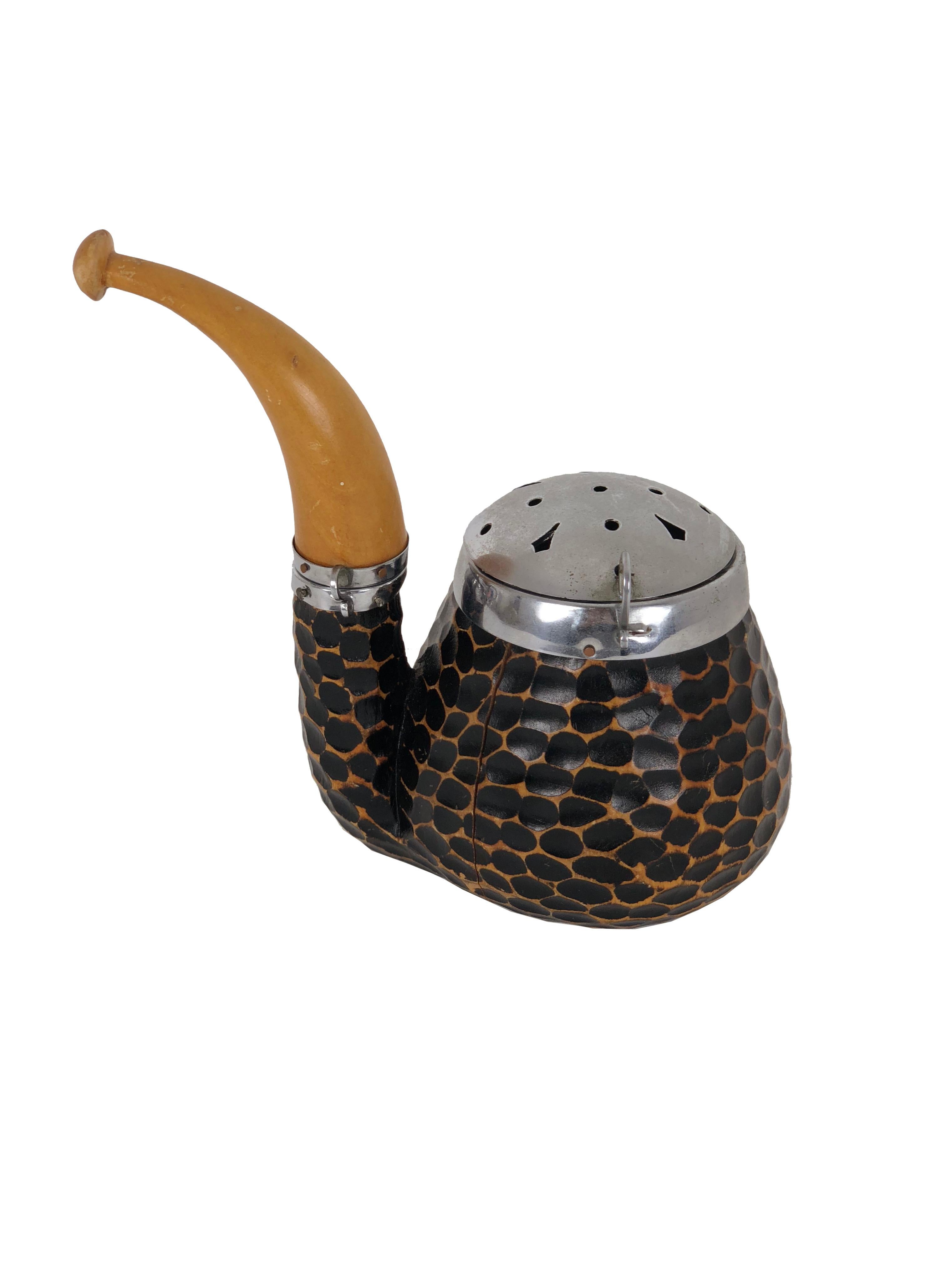 Tobacco container by Aldo Tura, Italy 1940s in brass and wood. The container has two compartments, one for storing tobacco and another for storing and lighting. As the photos show, the pipe as a cut on one side of the wooden 