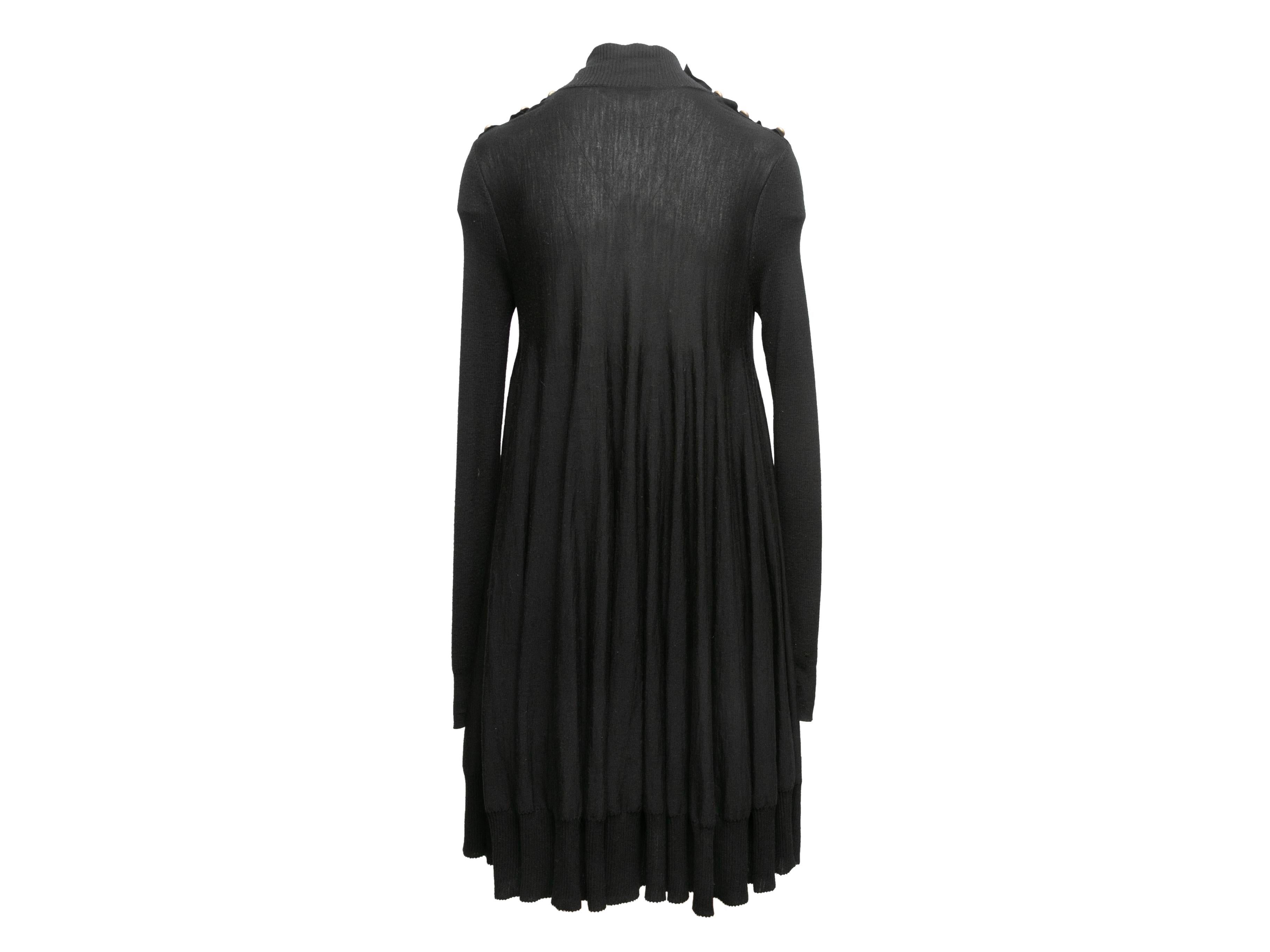 Vintage black lightweight sheer wool dress by Alexander McQueen. Mock neck. Long sleeves. Button accents at shoulders. 38