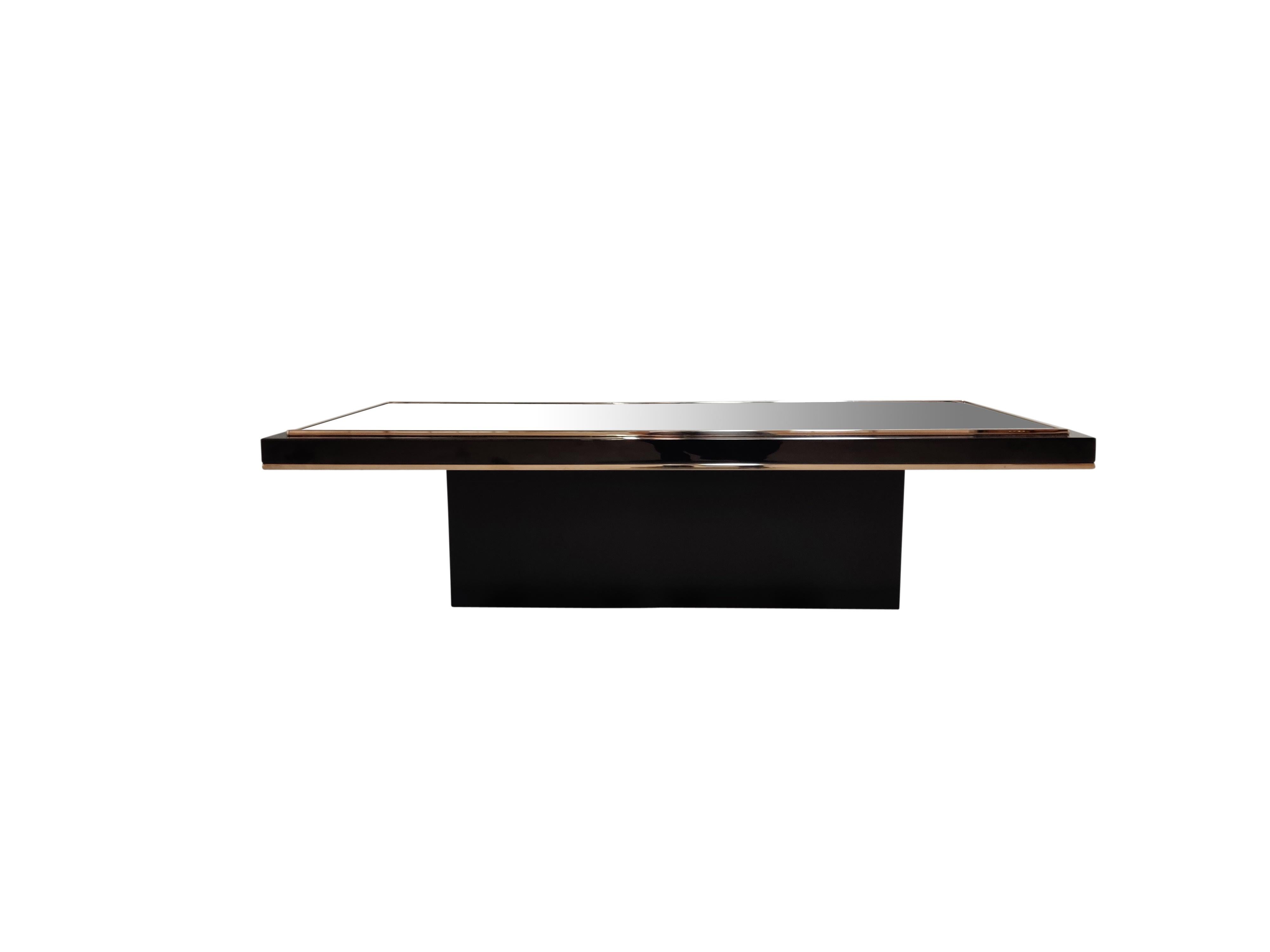 Quality 24-karat gold layered and black metal coffee table with a smoked glass top.

The table was manufactured by Belgochrom and produced quality furniture pieces with a luxurious appeal.

The table has had one previous owner and was maintained