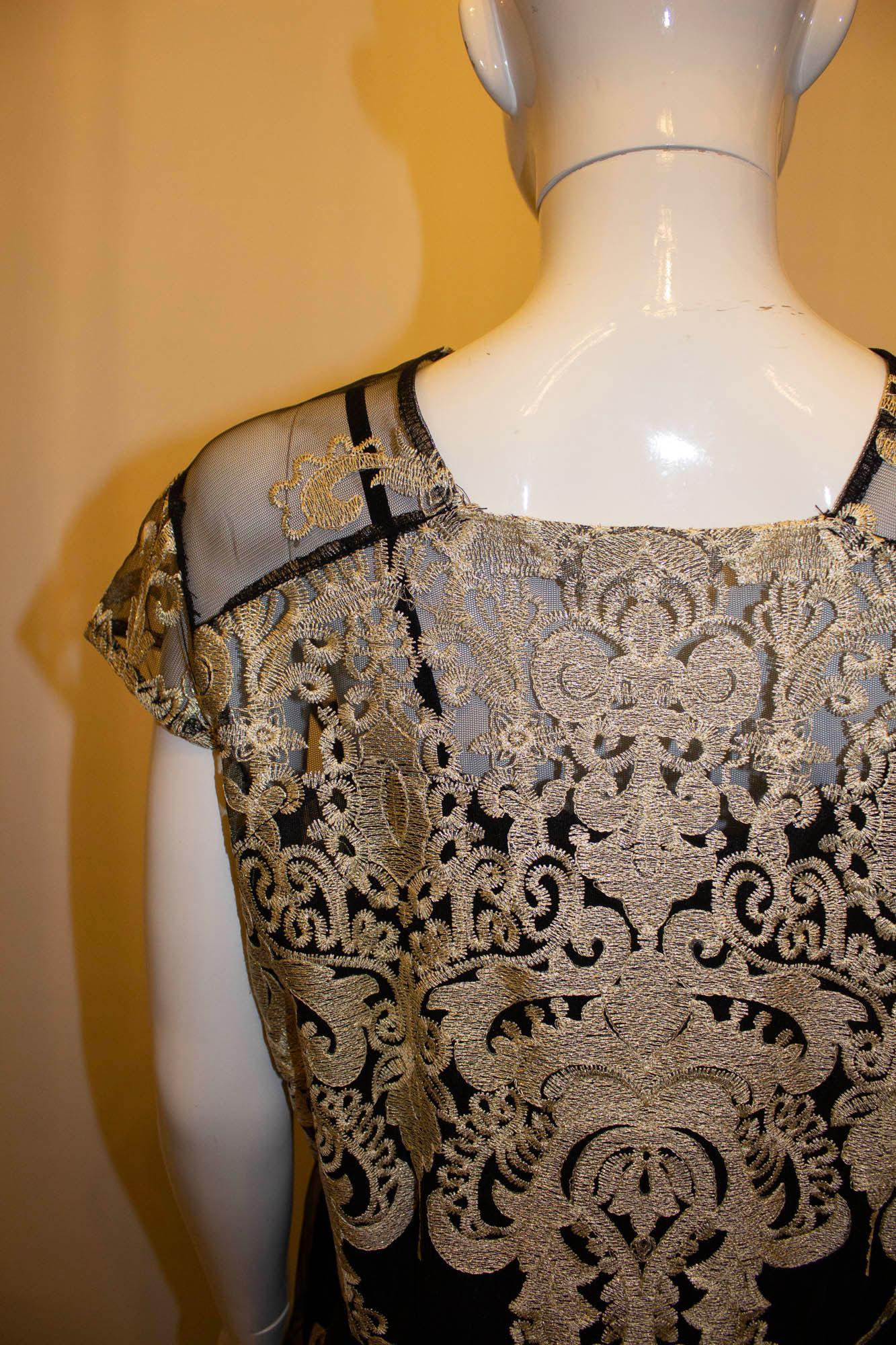 A fun and easy to wear vintage dress in black and gold lace. The dress has a side zip fastening , is fully lined and has a round neckline and backline. Best worn loose.
Measurements: Bust up to 14'', length 42''
