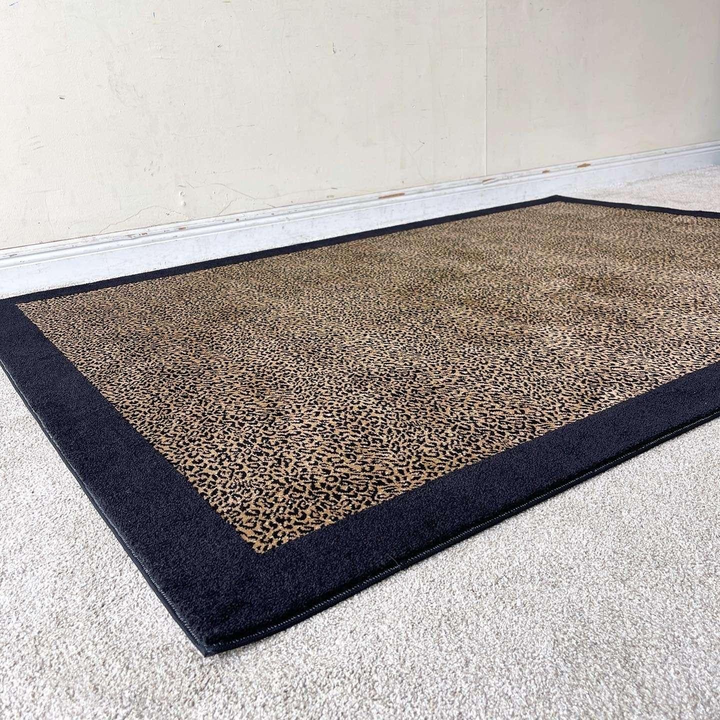 Amazing vintage postmodern rectangular area rug. Features a black outer edge with a leopard print interior.

Rug 12
