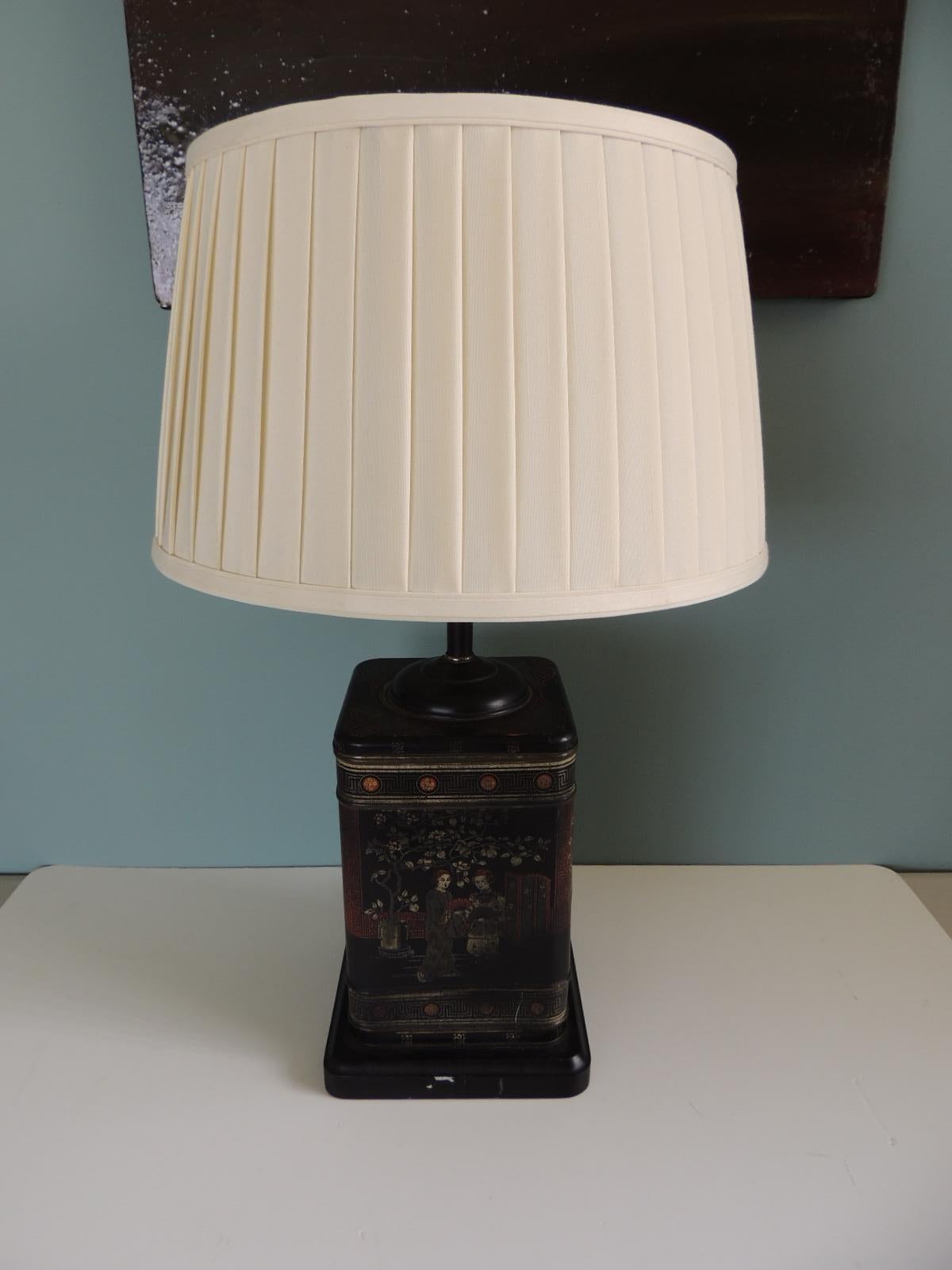Vintage Black Asian Tea Canister Table Lamp, with pleated
Linen lampshade in natural. Wood square base and wood finial.
Size: 11