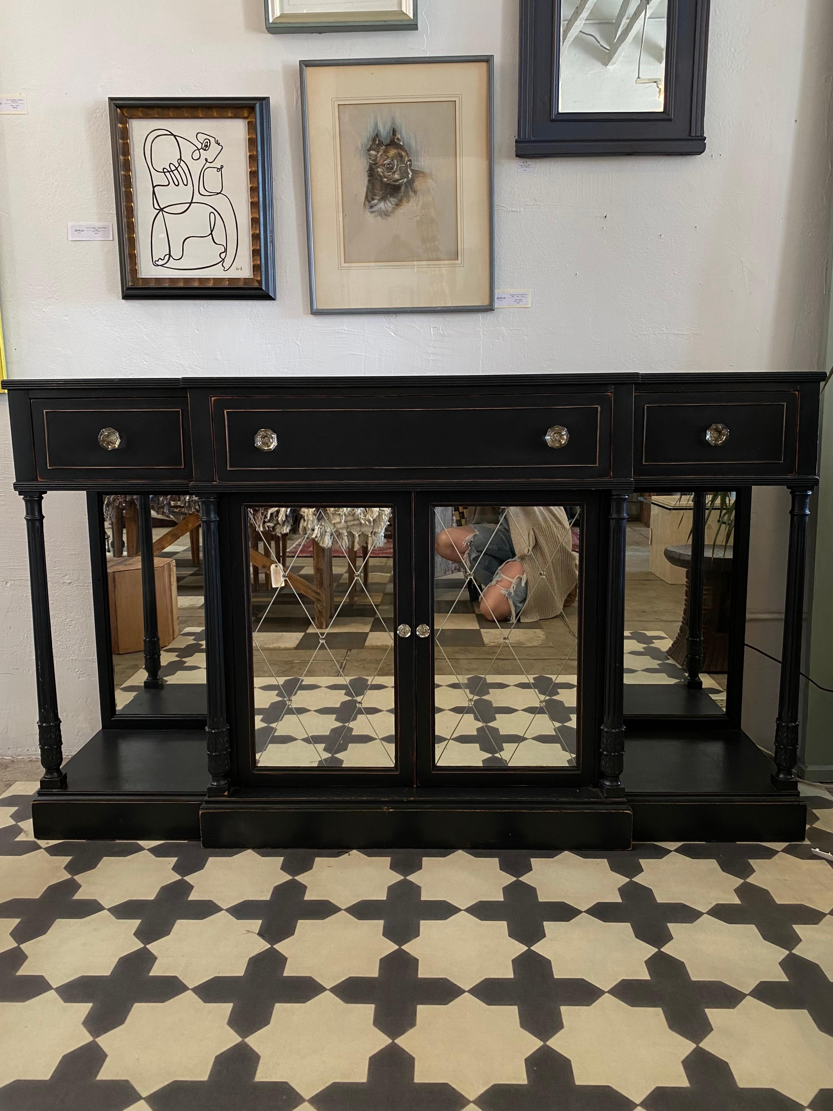 Vintage Black Bar Cabinet with mirrored detailing. This piece is in outstanding condition considering it's age with no structural issues.

Dimensions are 62