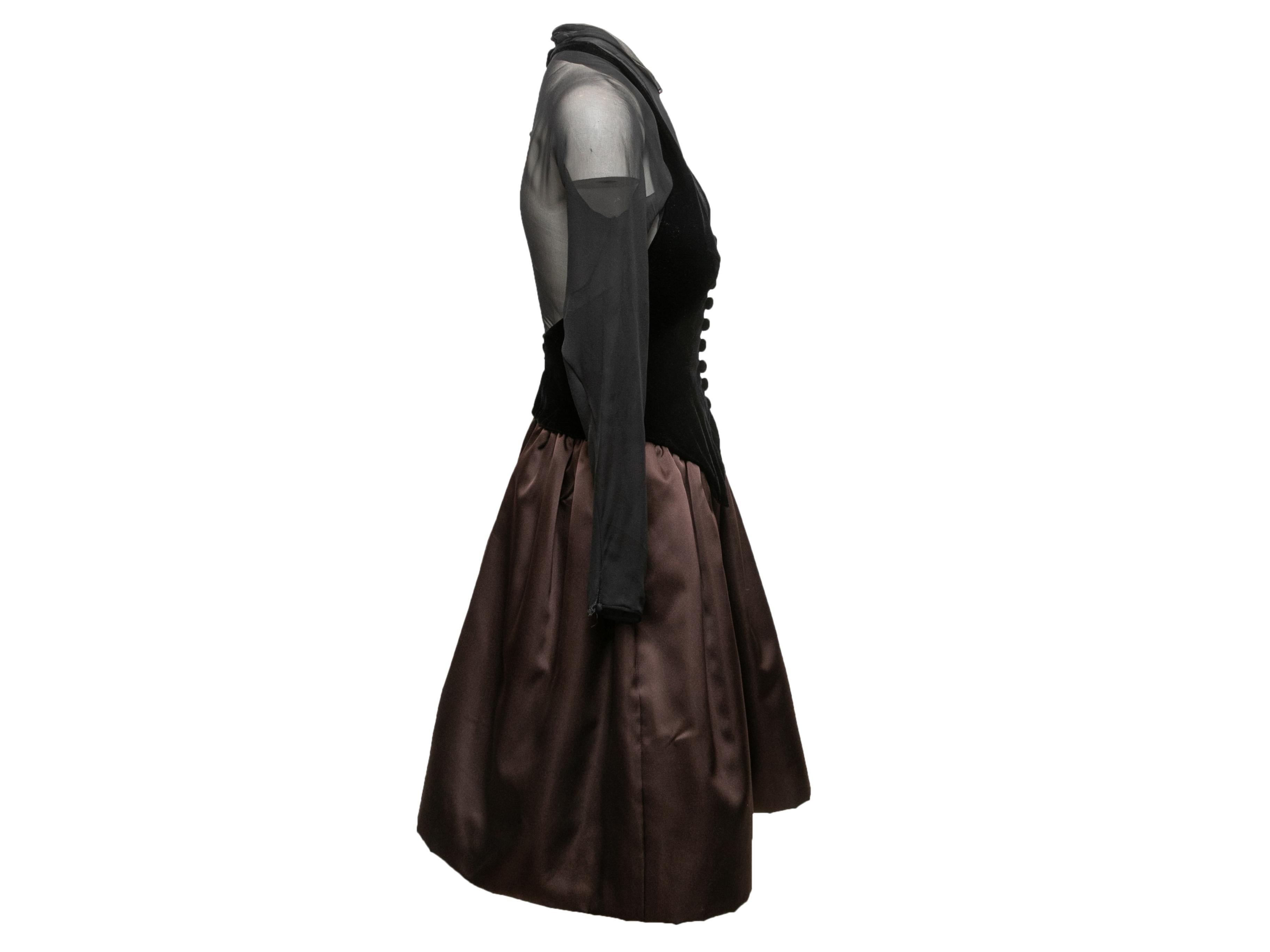 Vintage black and brown velvet and taffeta cocktail dress by Oscar de la Renta. Long sheer sleeves. Button accents at center front. Zip and button closures at center back. 28