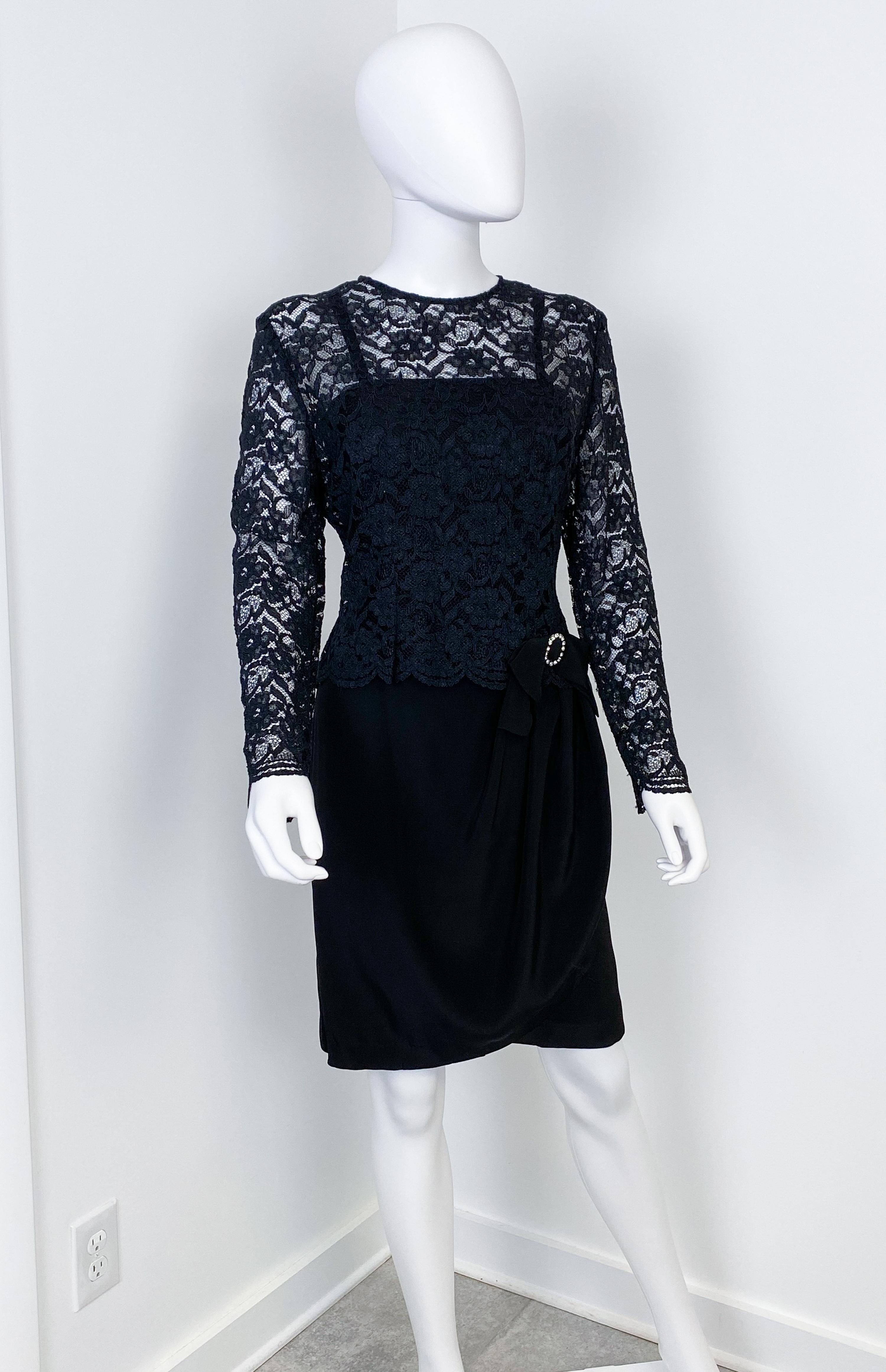 Superb vintage 1980s black lace semi-sheer blouse and black satin bustier evening dress. The reversed black satin dress has a fitted bodice with small straps. The skirt is hobbled but wraparound with an opening on the side and loose pleats. The
