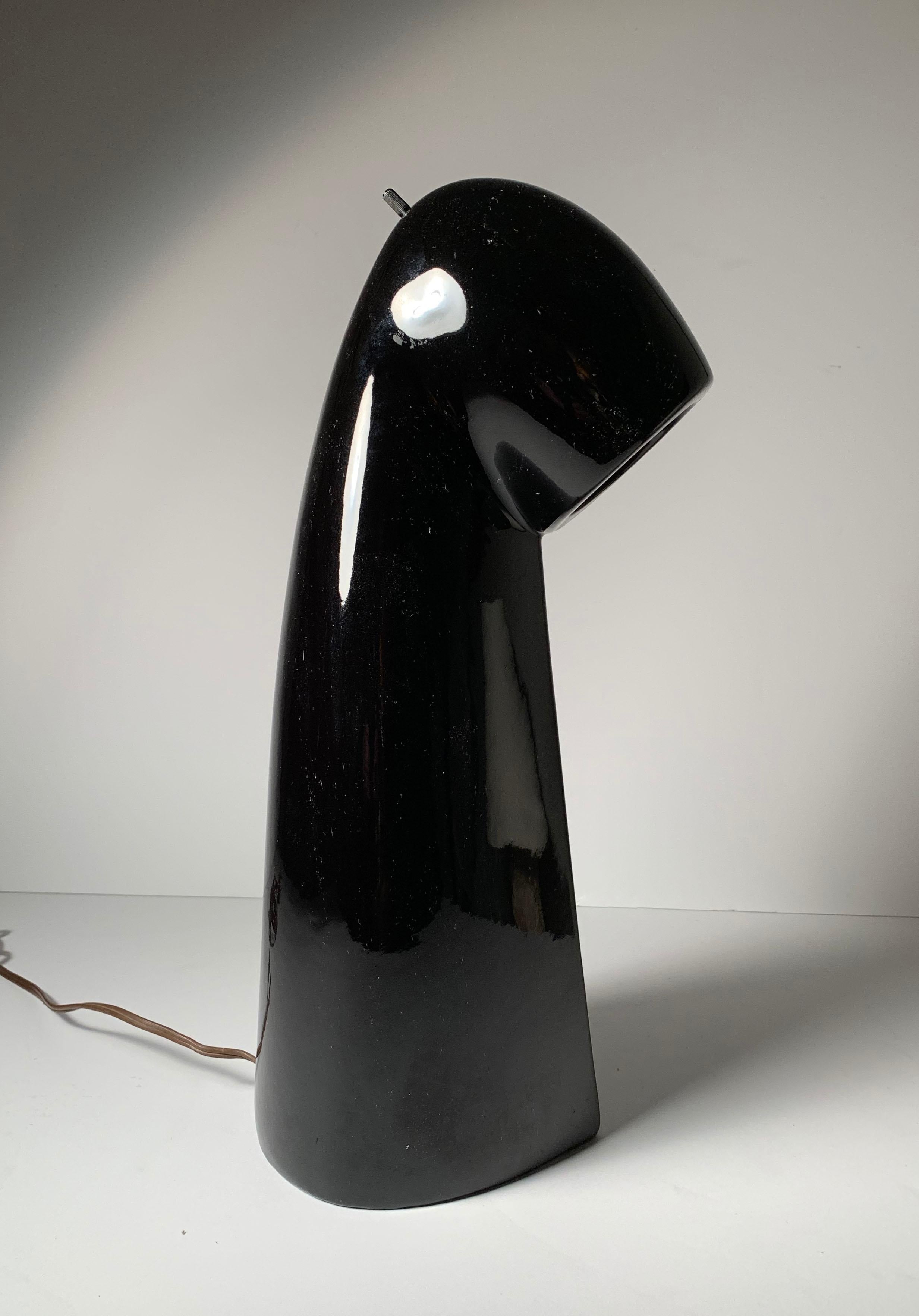 Vintage gloss black ceramic table lamp. Dating to the late mid century. Similar time period to Martz. Designer unknown. 