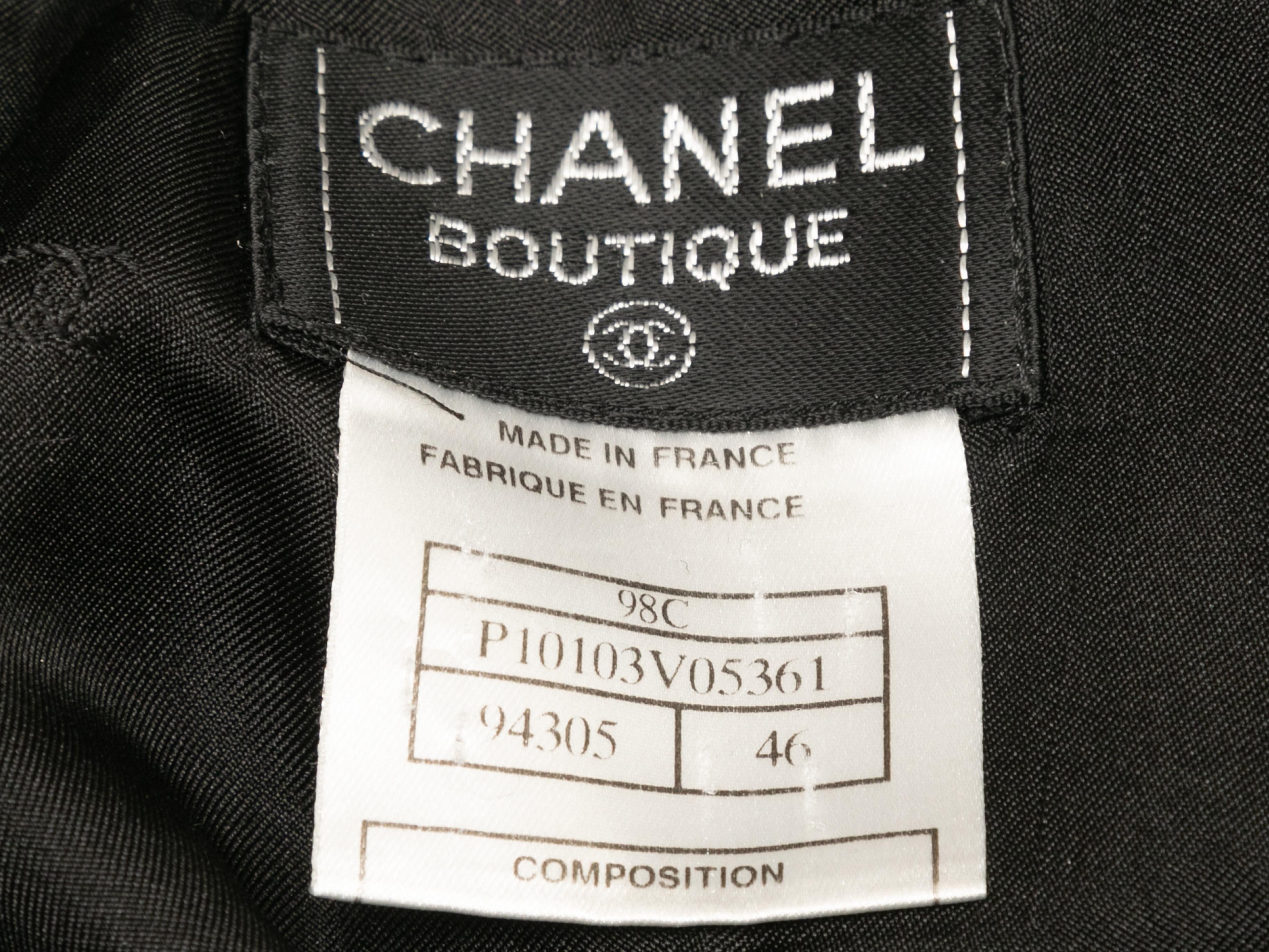 Vintage black wool pencil skirt by Chanel Boutique. From the Cruise 1998 Collection. Back zip and button closures. 31