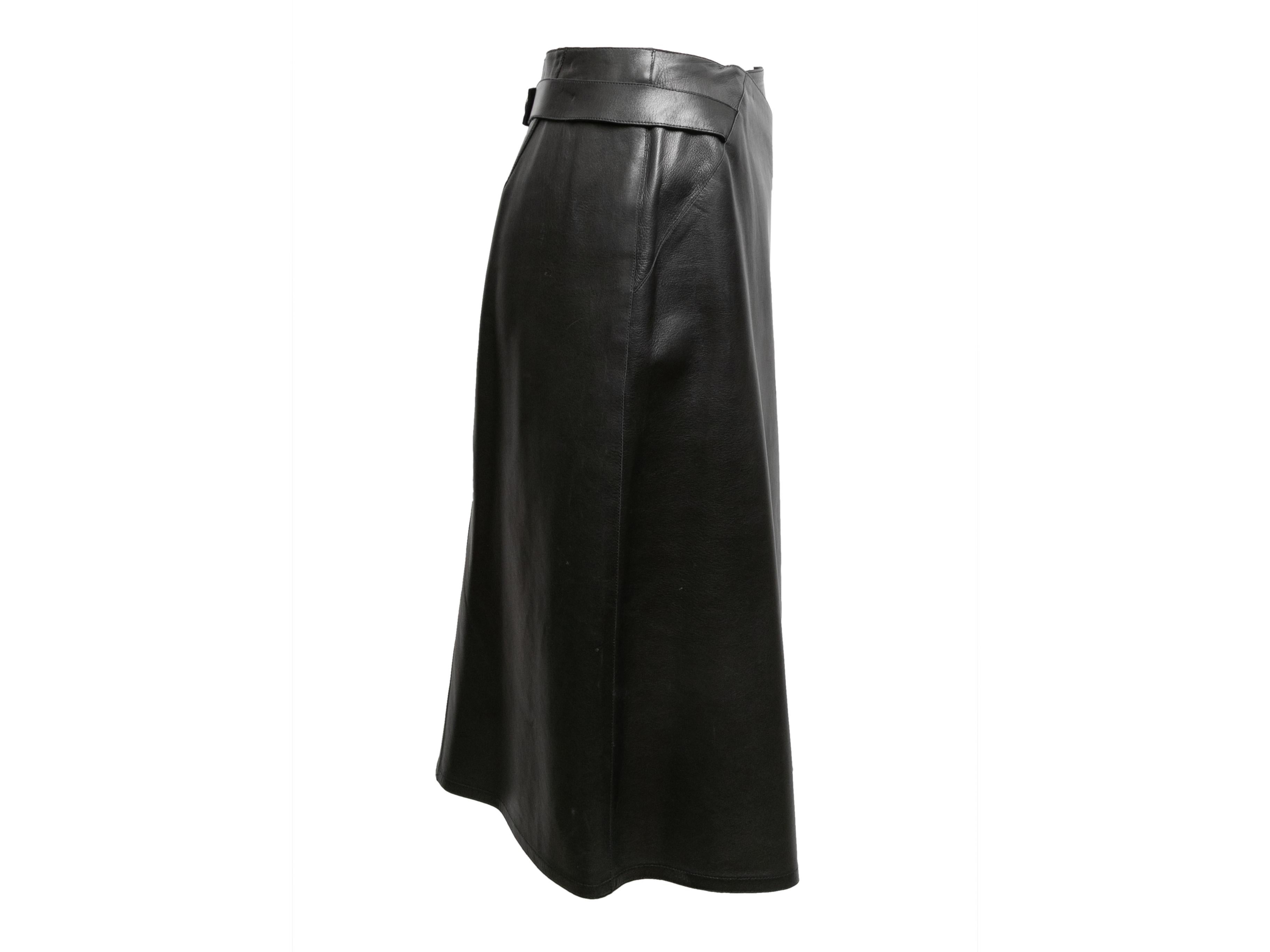Vintage black lambskin leather wrap skirt by Chanel. From the Fall/Winter 1999 Collection. Button closure at back waist. 28