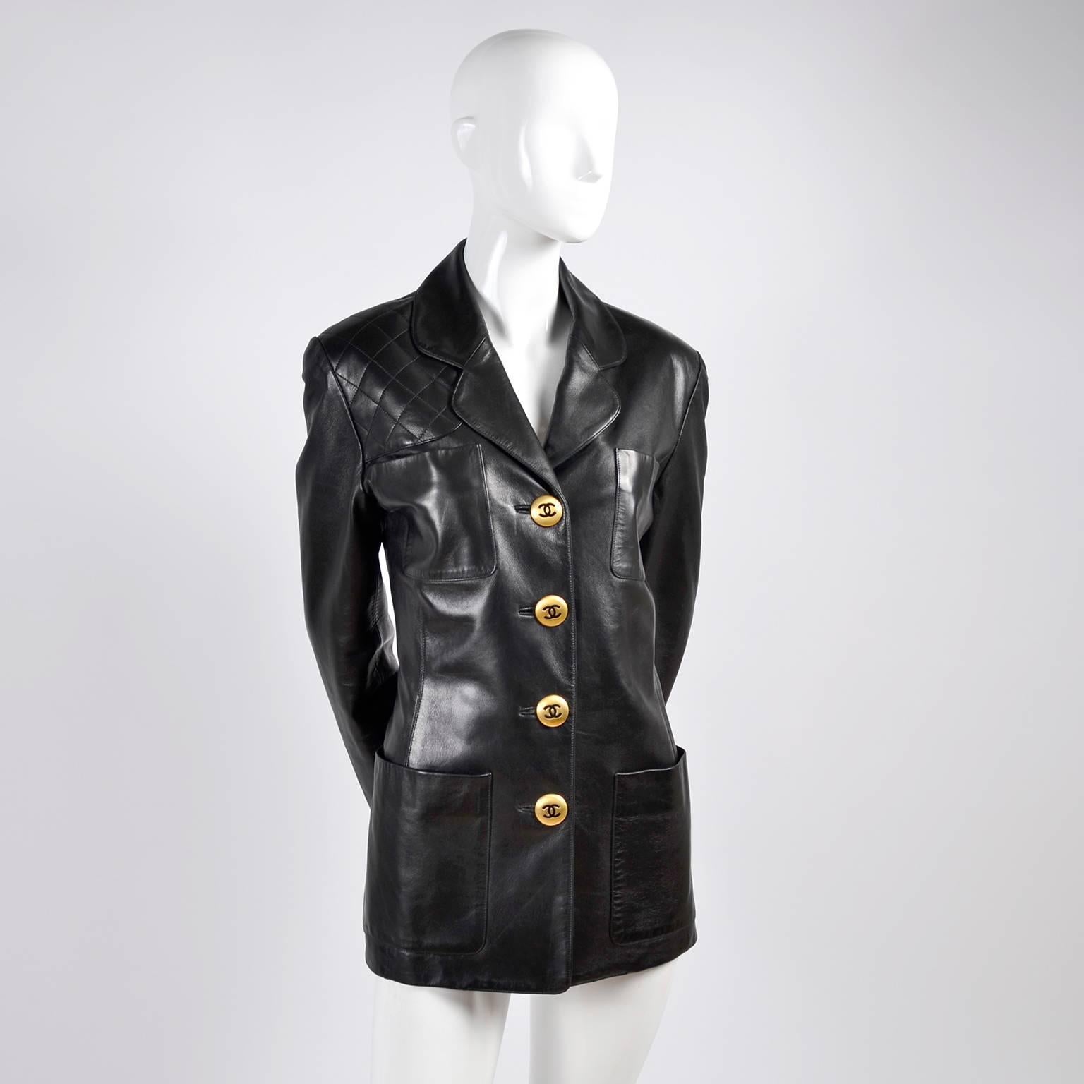 This vintage Chanel black leather jacket has beautiful large brass CC logo buttons and front pockets. The jacket is a timeless classic and can be worn in so many different ways! This leather Chanel blazer is lined in silk CC logo lining, and we have