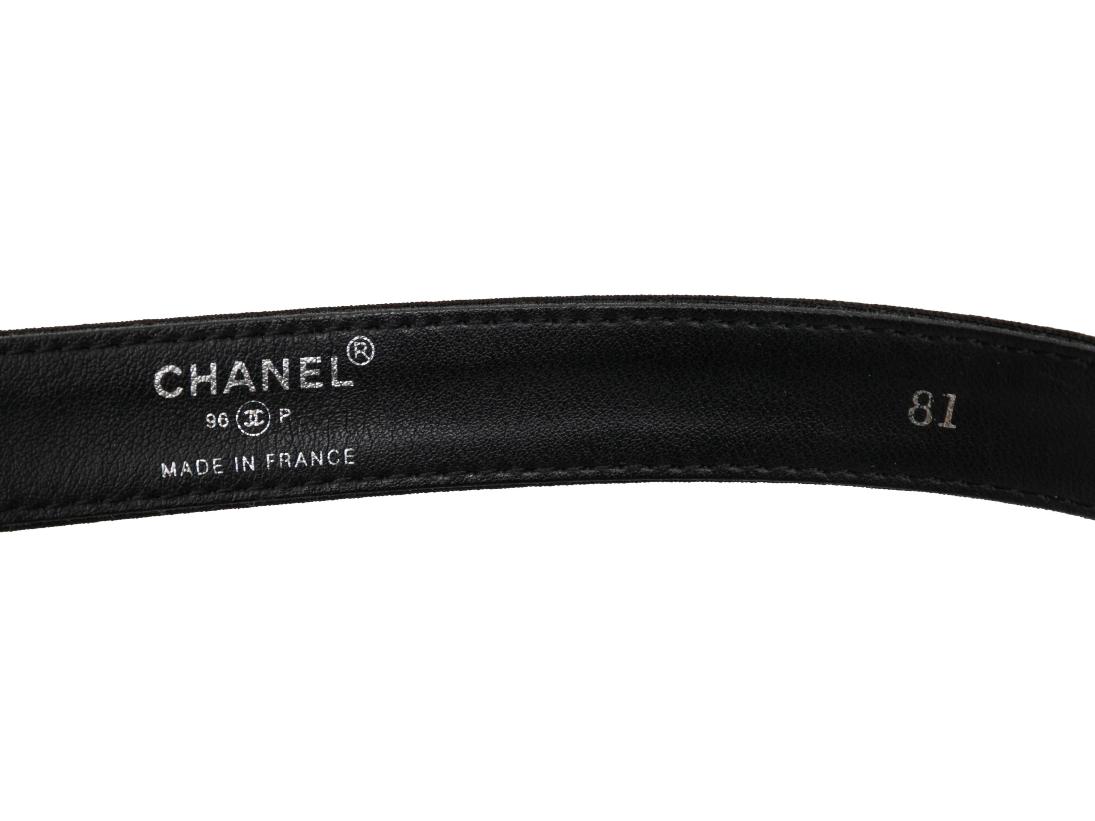 Vintage black nylon and leather belt by Chanel. From the Spring/Summer 1996 Collection. Silver-tone logo buckle clsoure. 1