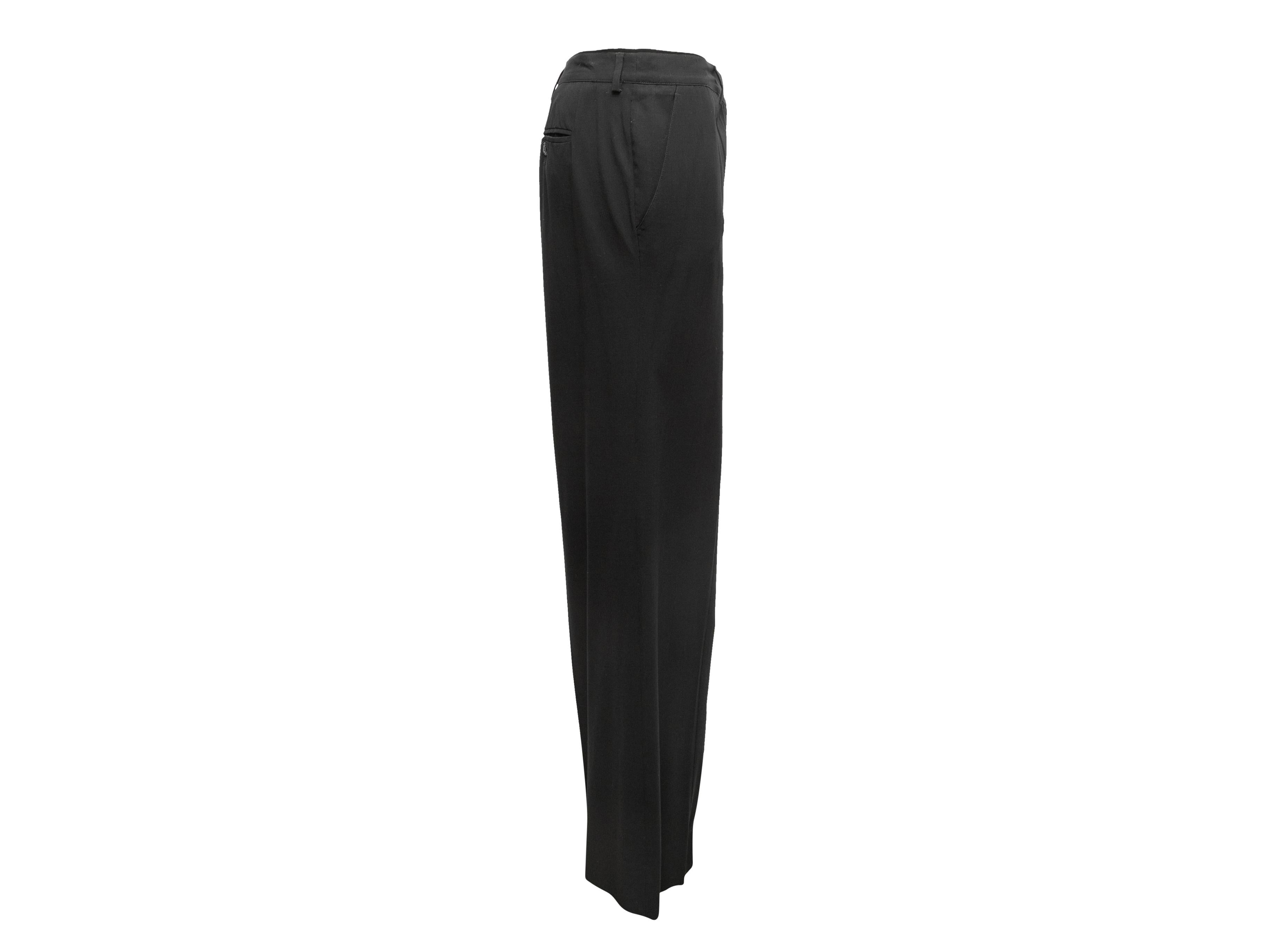Vintage black wool trousers by Chanel. From the Spring/Summer 2003 Collection. Three pockets. Zip closure at front. 39