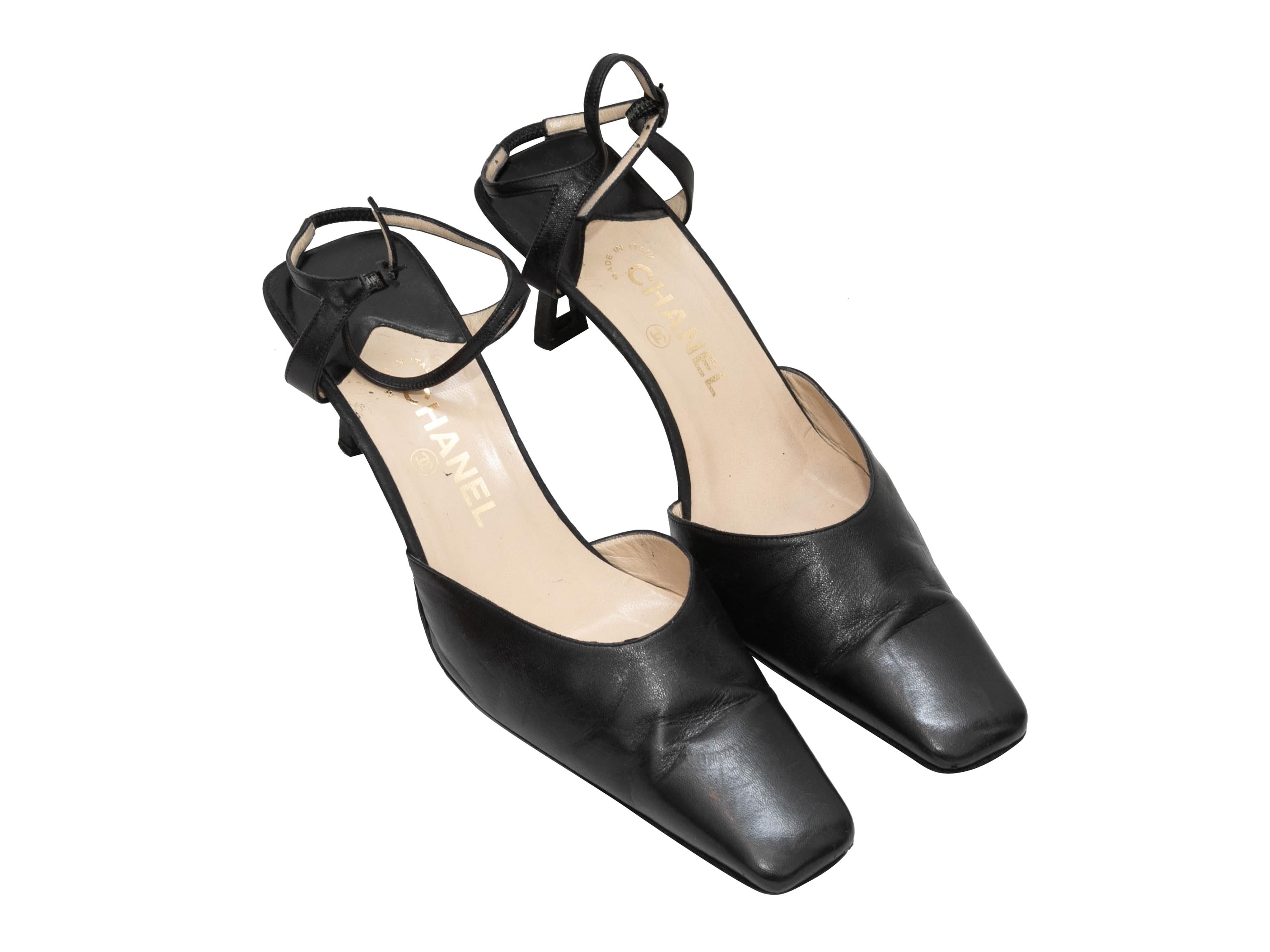Vintage black leather square-toe heels by Chanel. Buckle closures at ankle straps. 2.5