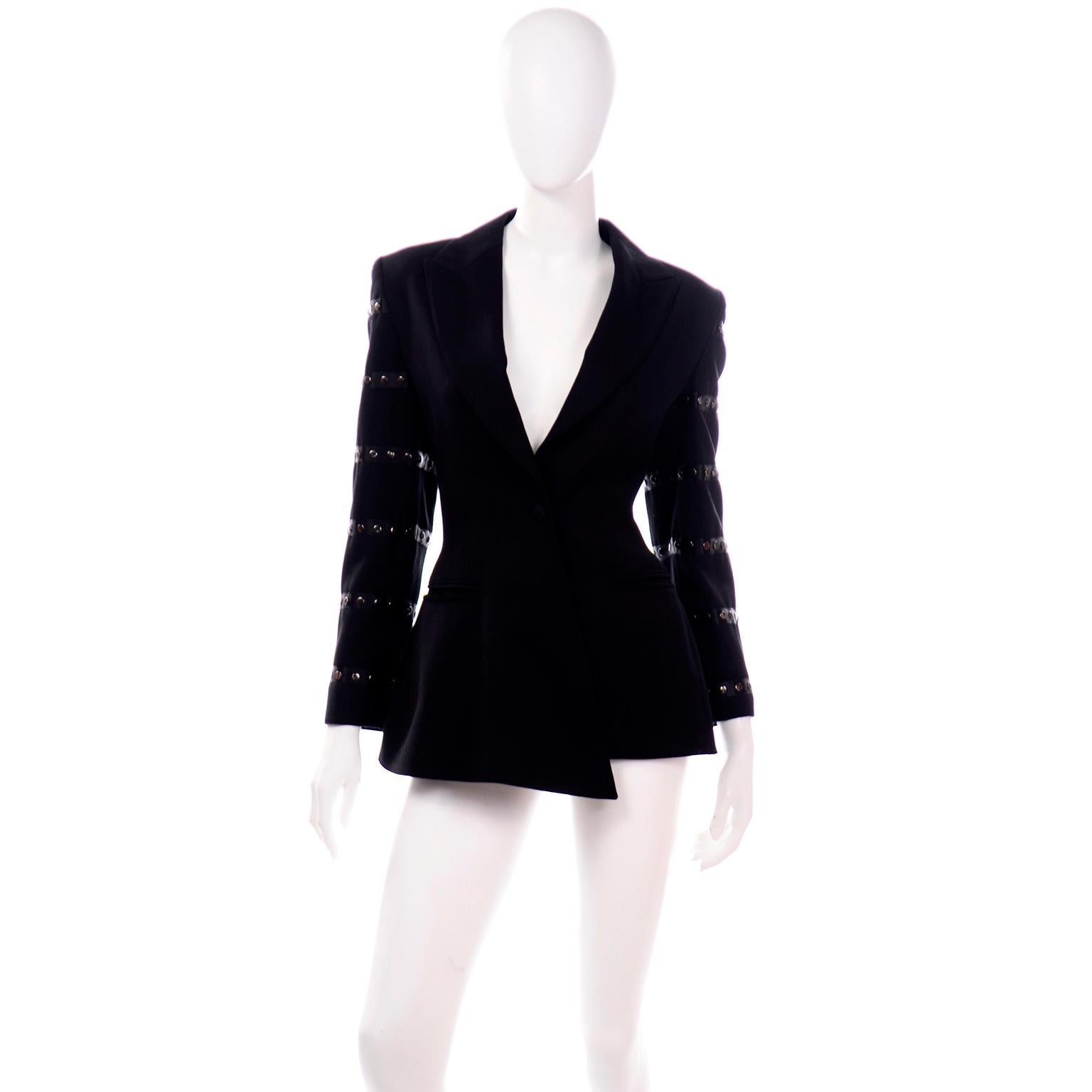 This is an asymmetrical vintage Claude Montana jacket in black wool with a single snap closure and front slit pockets. This great vintage late 1980's jacket is fully lined in rayon and we love the avant garde hemline with a center front point. The