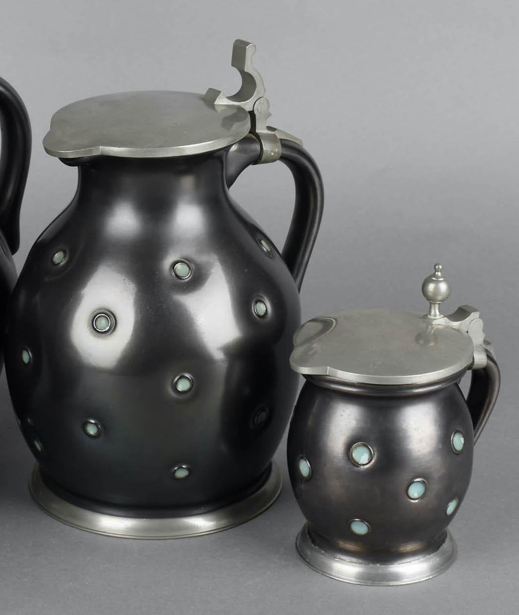 Black coffee set by Eugen Wiedamann is an original decorative group of objects realized between the 1950s and the 1960s. 

Made in Germany. Realized by Eugen Wiedamann, Regensburg.

The work is composed by different materials: metal, enamel, and