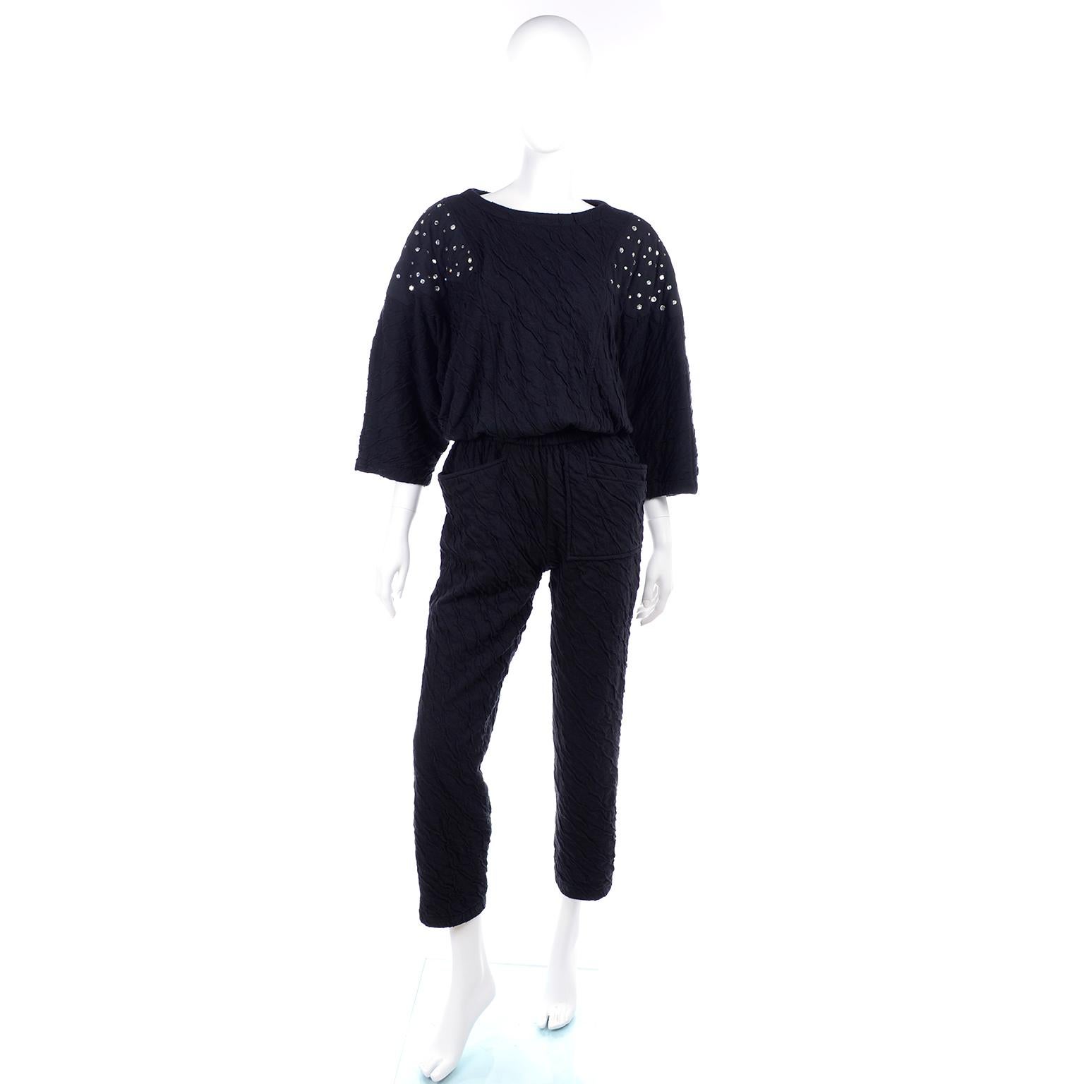 This is a really great black vintage jumpsuit from the 1980's in a crinkle cotton lycra blend. This Hi Tech by Dina  jumpsuit originally had shoulder pads but the owner removed them, you can put them back in easily!   Labeled size medium,  metal