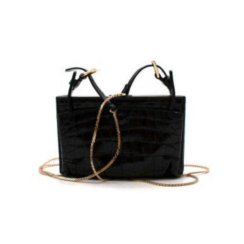 Valentino vintage black croc embossed leather box bag
 
 
 
 -Gold tone hardware 
 
 -Gold adjustable chain 
 
 -Snap closure pouch 
 
 -Clasp fastening opening 
 
 -Stud details 
 
 -Crocodile embossed leather body 
 
 
 
 Material:
 
 
 
 Leather