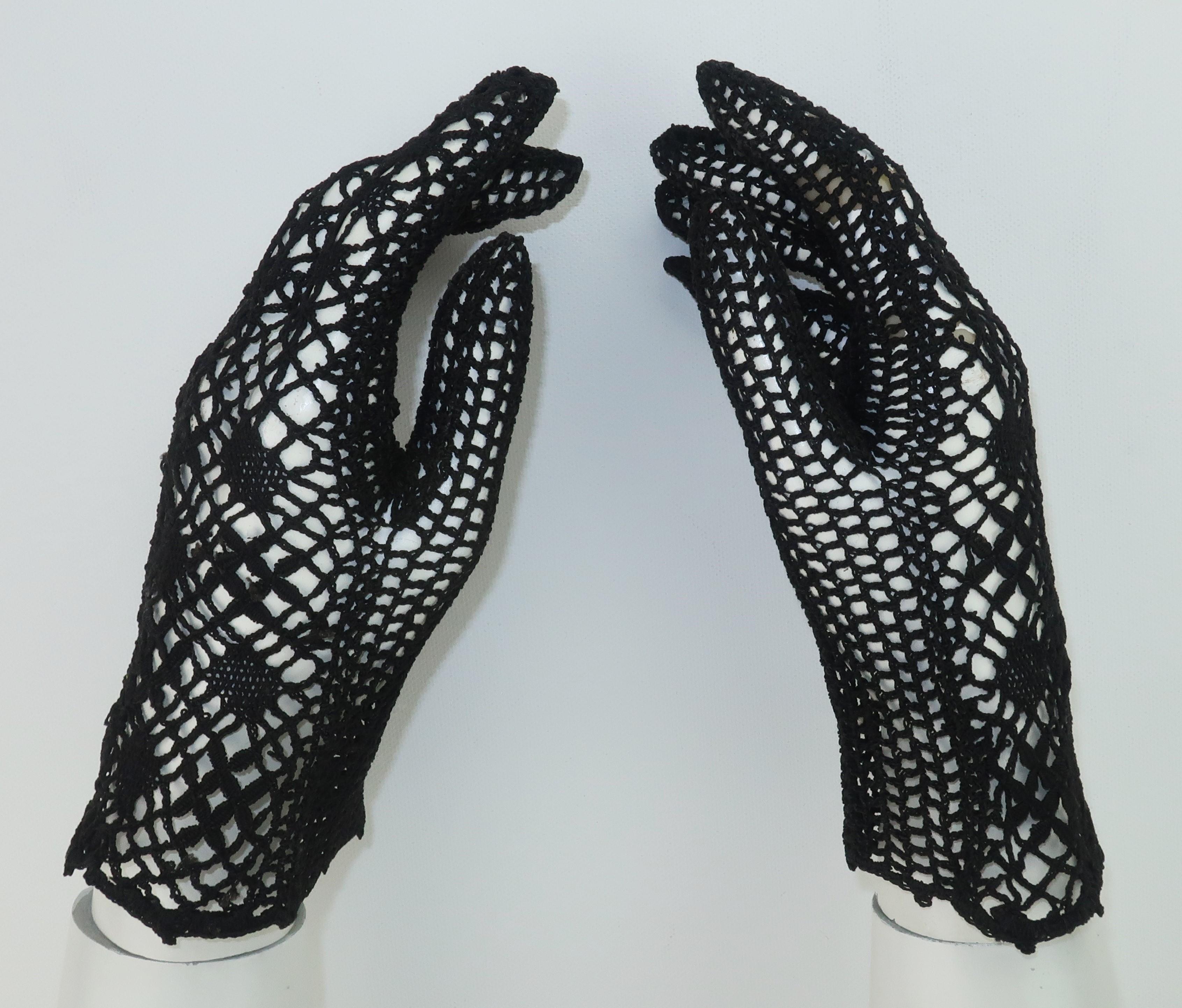 Add a vintage touch to day or evening attire with these black crochet net gloves.  The fine threading appears to be a silk and cotton blend and though unmarked they best fit a size 7.  Beautiful condition and appear rarely, if ever, worn.