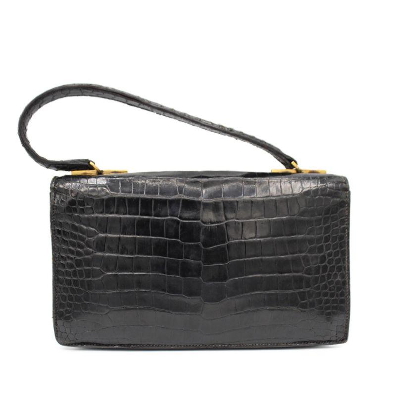 Hermes 60's vintage crocodile bag.

Good vintage condition for . a 60 years old bag but it presents signs of wear in the crododile leather and inside.
Clasp working perfectly
Packaging:  Opulence Vintage dustbag

Additional information:
Designer: