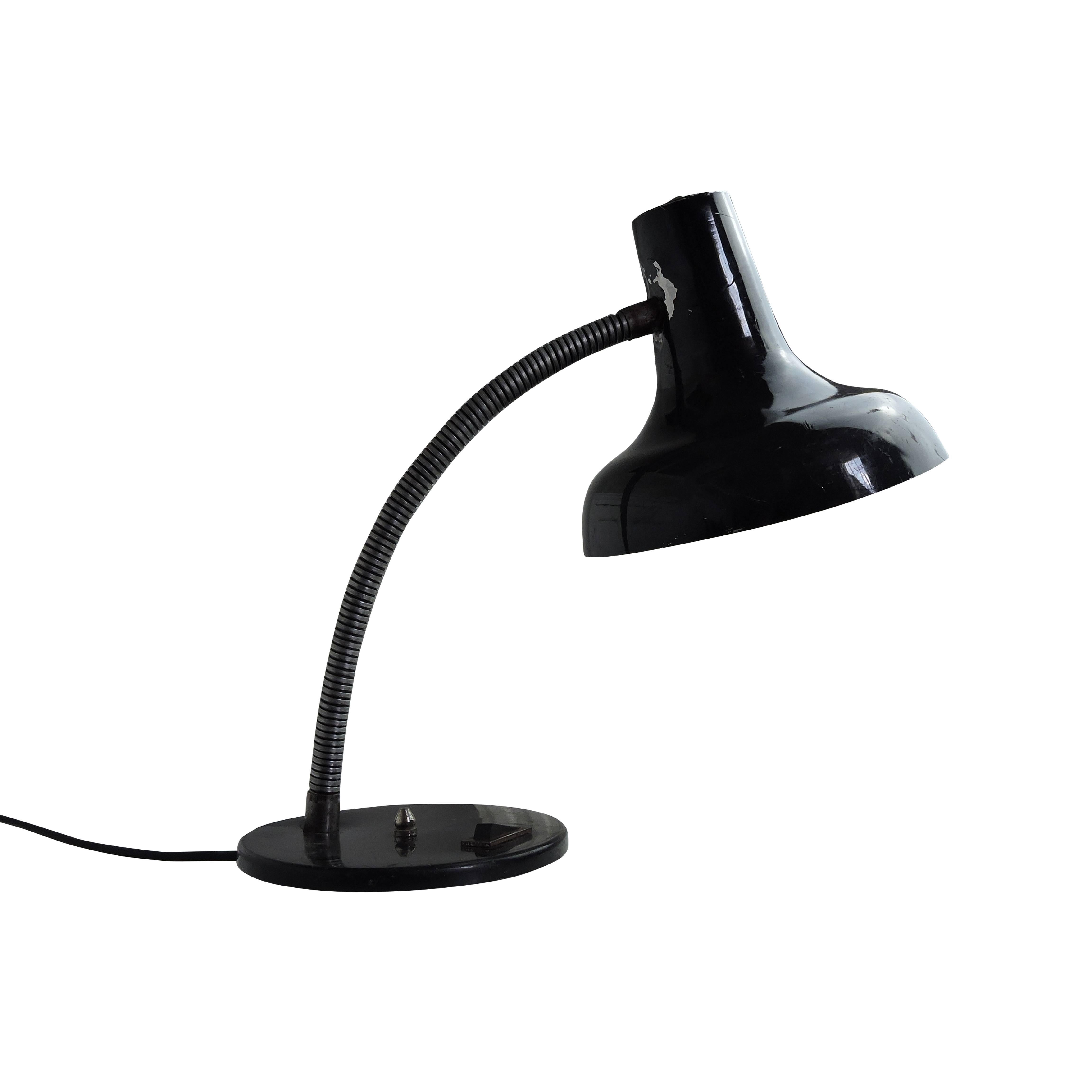 This black desk lamp features an adjustable lampshade.