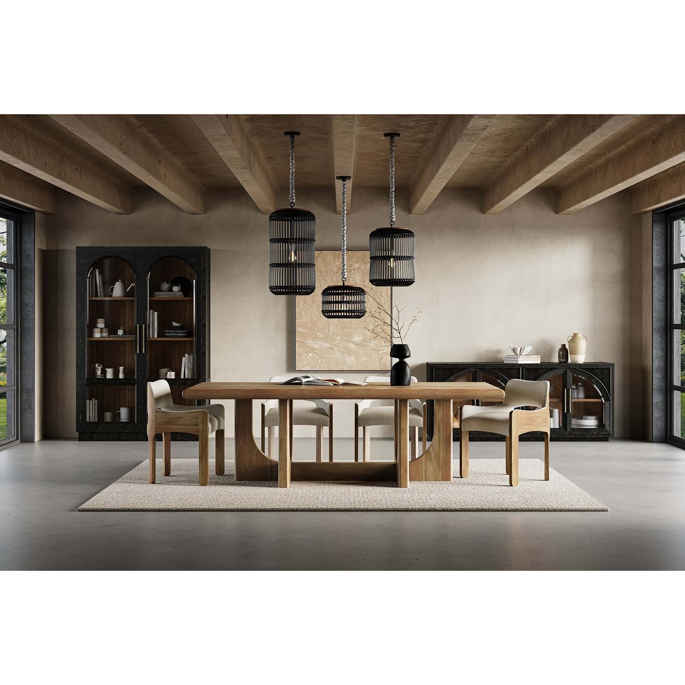 Finished in a vintage black and featuring a charming straw wash interior. This cabinet serves as a striking focal point in any room, offering a sophisticated touch with its classic design. The arched glass doors provide the perfect stage to showcase