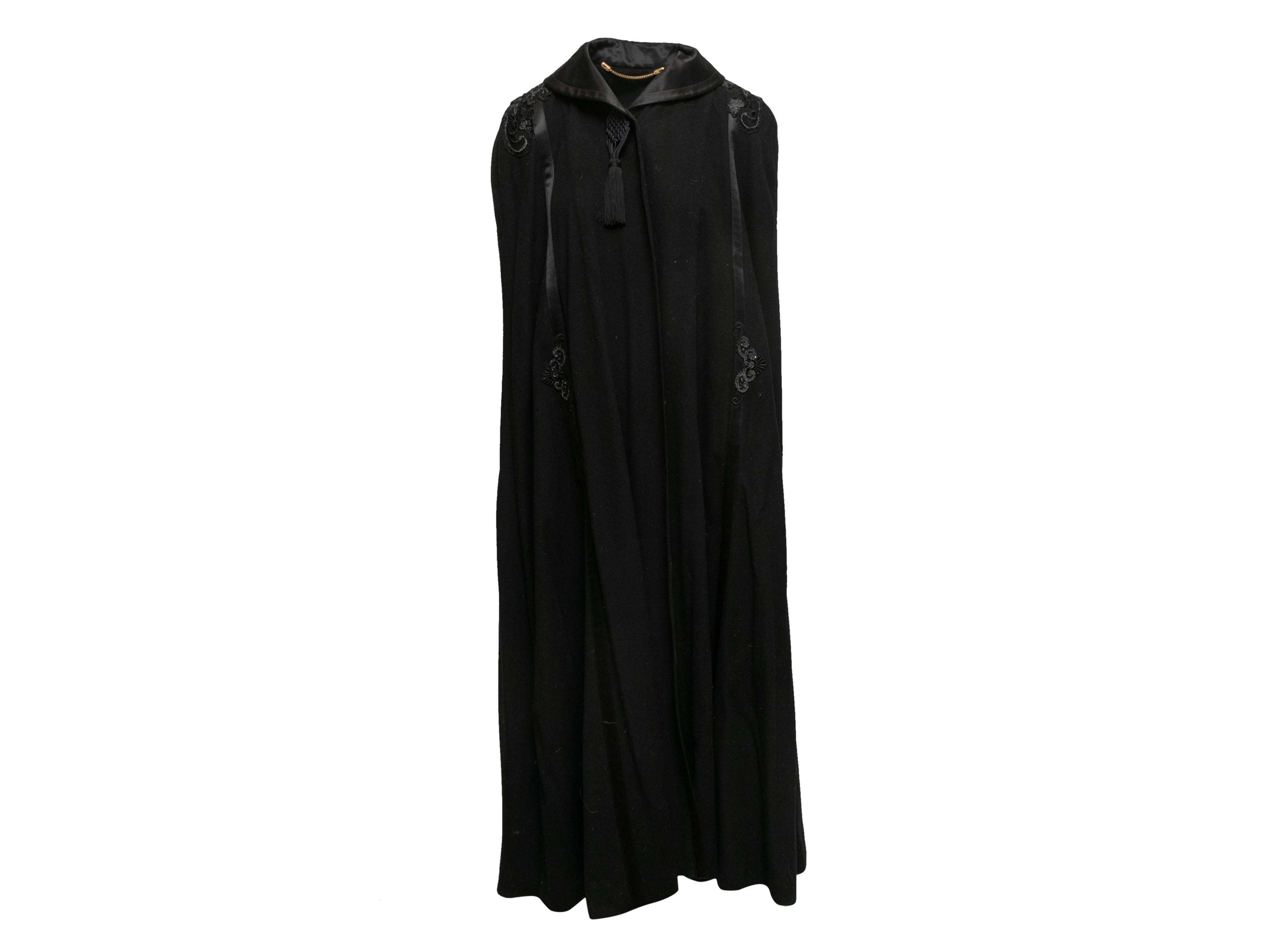 Product Details: Vintage black long wool cape cloak by Escada. Embroidered detailing at shoulders. Front closure. 62