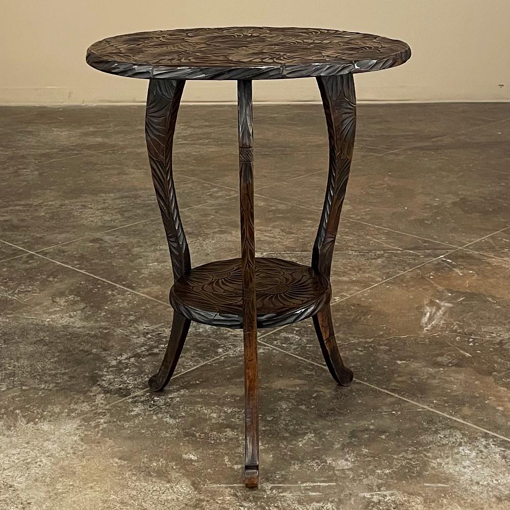 Vintage Black Forest Style Carved Lamp Table was carved from solid sycamore to depict a thick canopy of flowers and leaves, hand-crafted for the Liberty & Company of London!  The round top is completely covered with the bold carved floral motif,