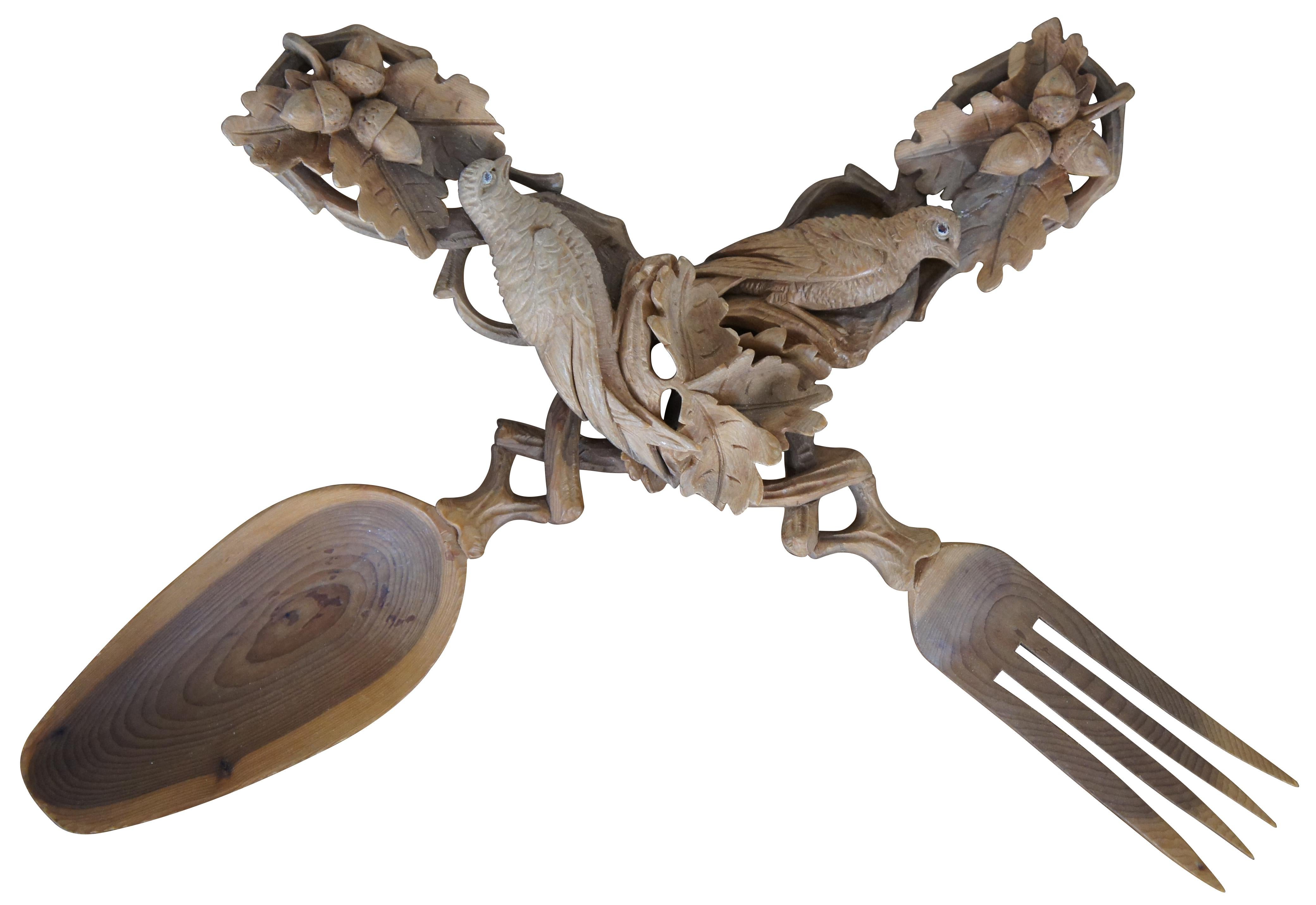 Vintage carved Black Forest German / Bavarian / Polish / folk art wood serving spoon and fork set / salad tossers intricately carved with high relief birds perched in pierced interlocking branches, full of oak leaves and acorns. Measure: 11