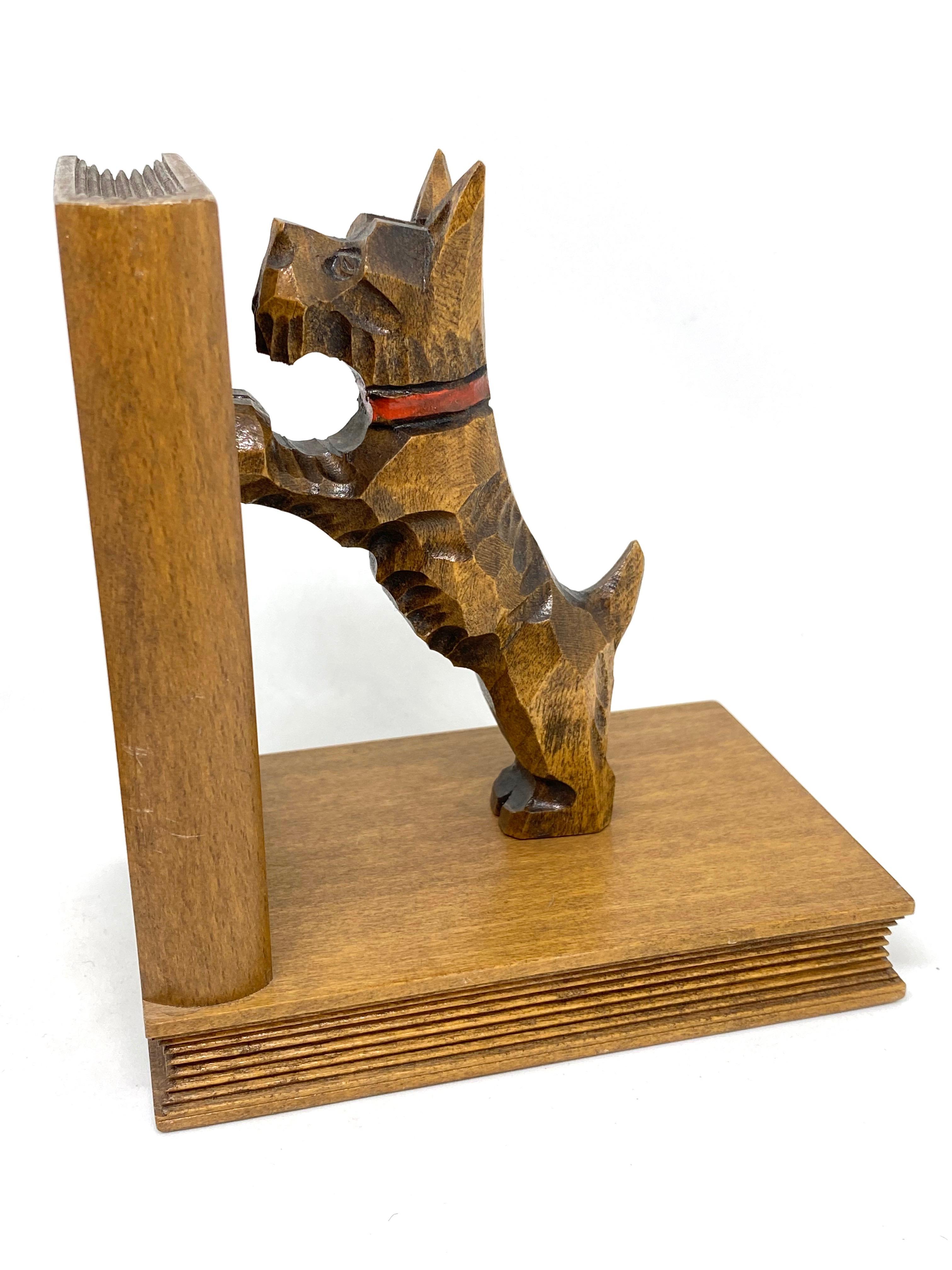 Classic 1950s Black Forest wood carved scotty dog bookends. Nice addition to your room or just for use on your shelf. Found at an estate sale in Nuremberg, Germany.