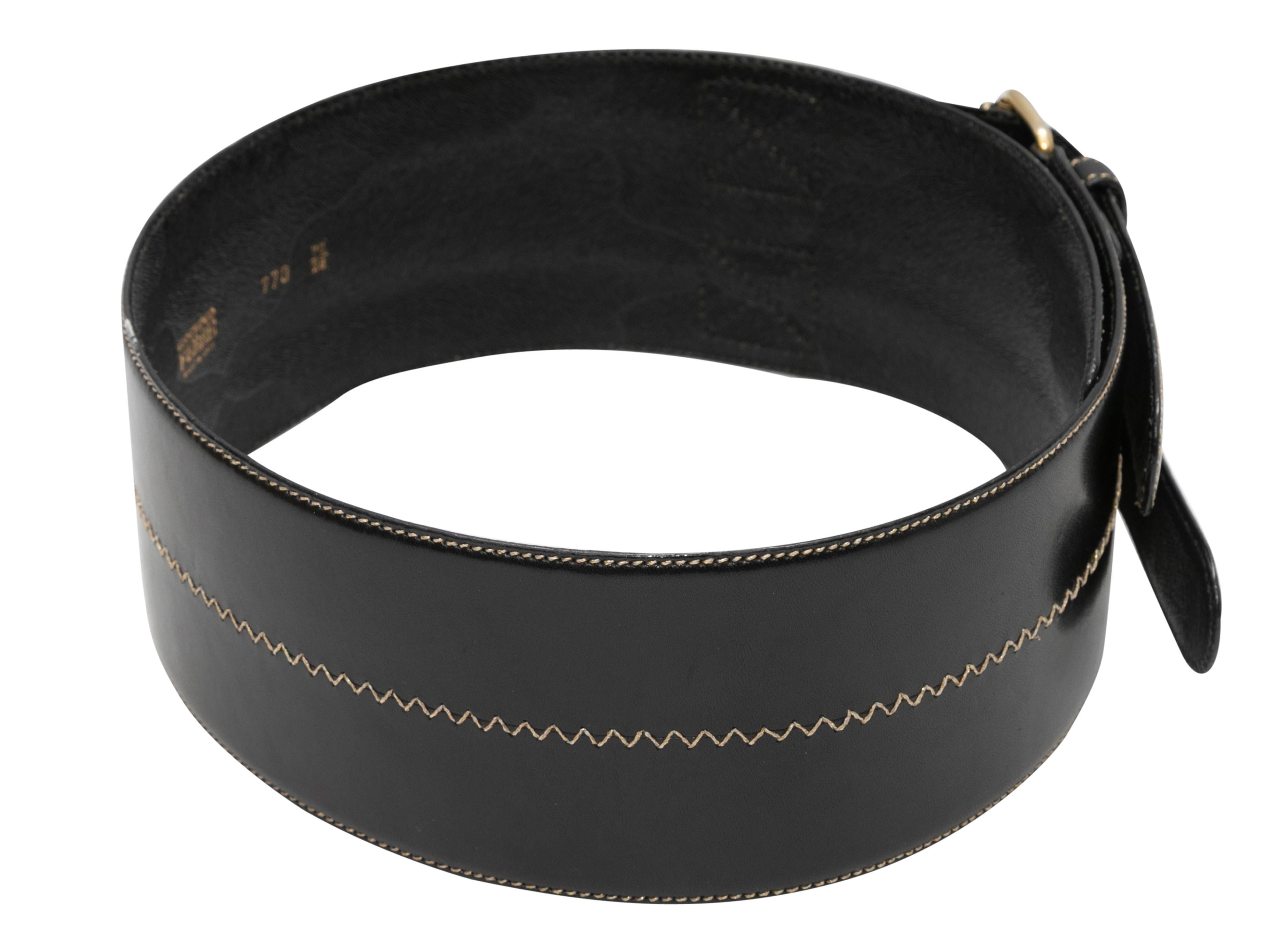 Vintage black wide leather belt by Gianfranco Ferre. Contrast stitching throughout. Dual gold-tone buckle closures. 3