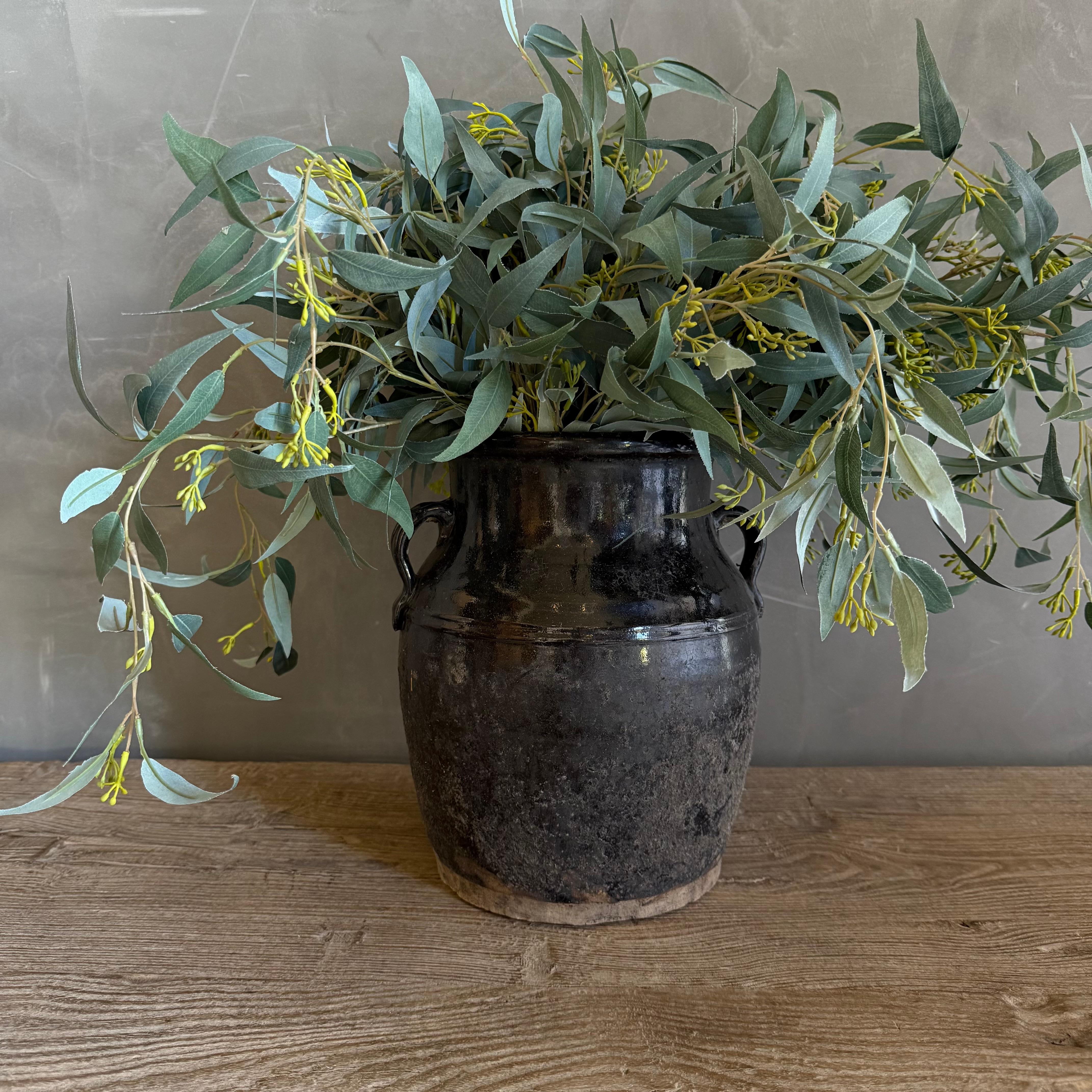 Small black glazed pottery, wabi sabi style with perfect imperfections. Each piece is unique, embodying a one-of-a-kind charm that adds character to any space. The deep, lustrous black finish enhances the simple yet elegant design, making it a