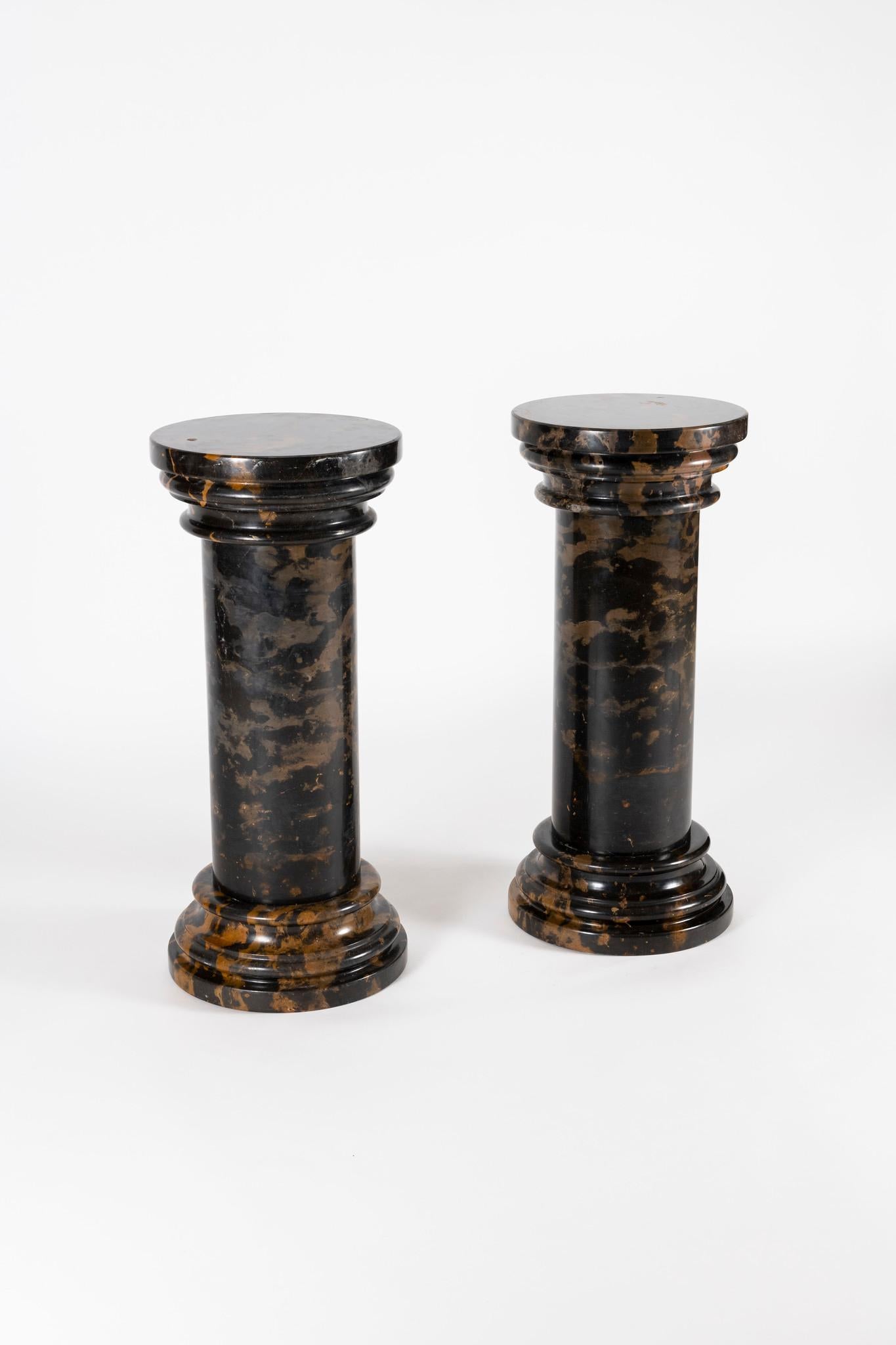 Available are two handsome and sturdy vintage black gold marble pedestals. Each pedestal is assembled in three parts, base, column and capital. Sold individually.